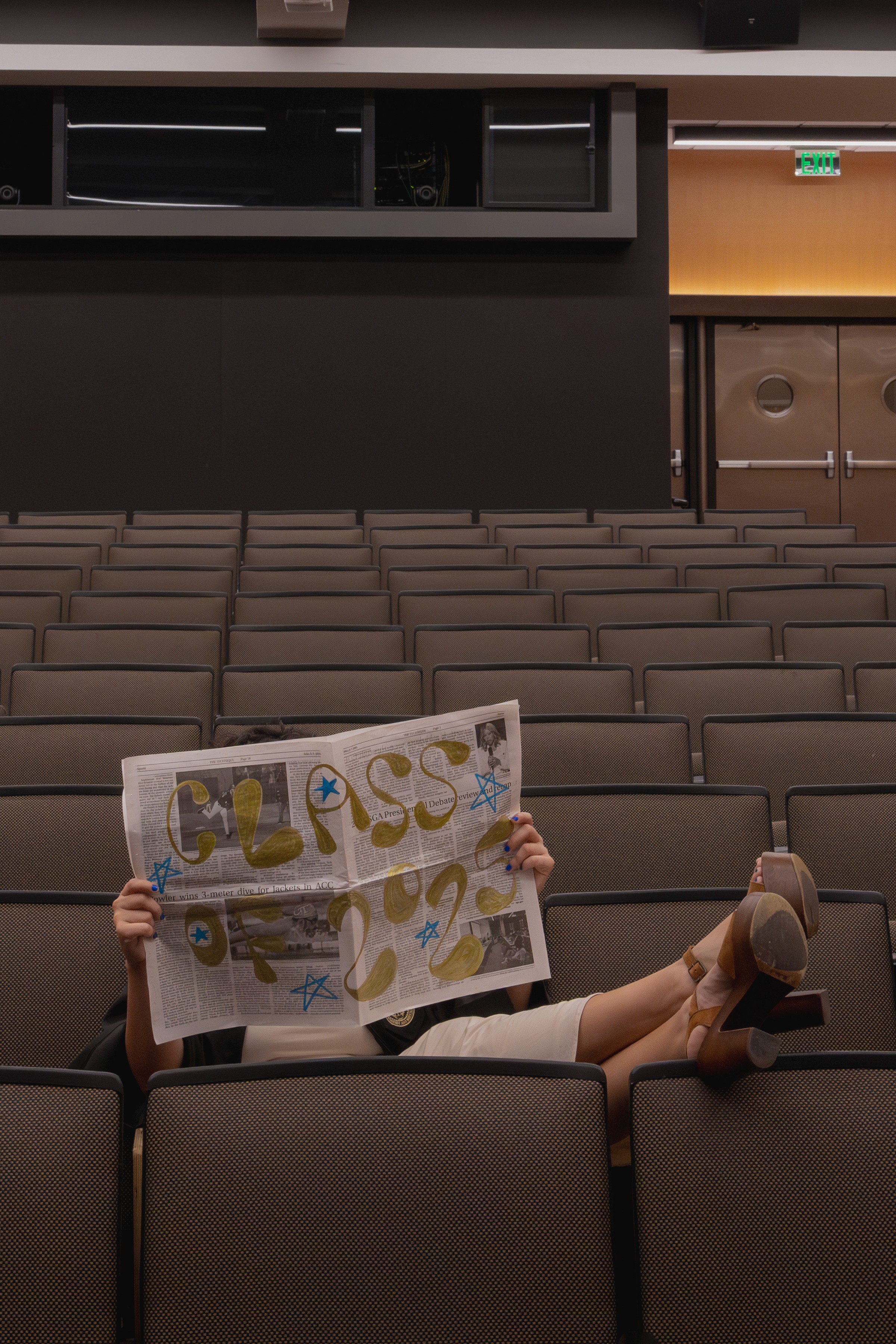 Cool, nontraditional graudation photo session in a lecture hall in Atlanta, Georgia