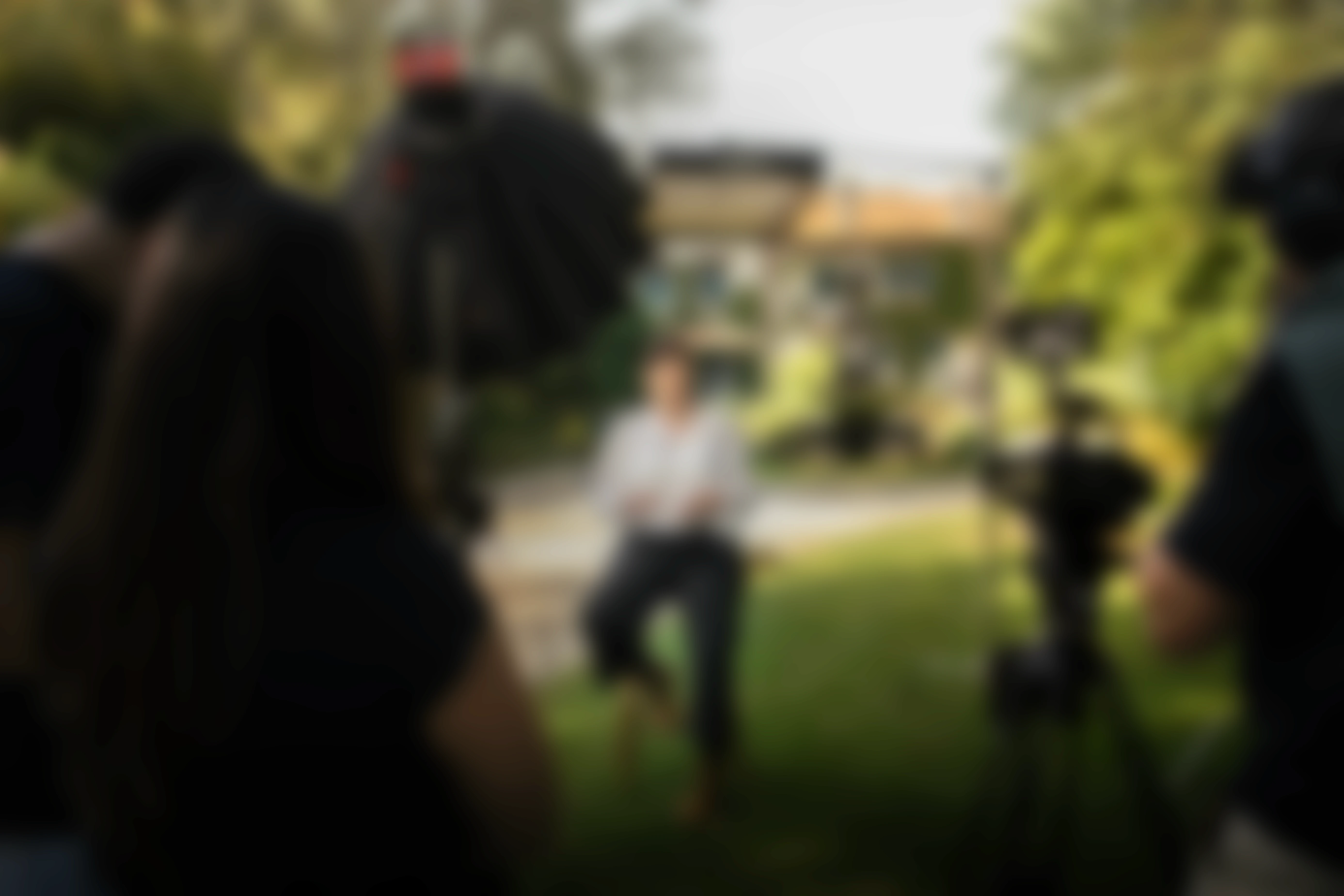 Futuristic sneaker with silver and green details, slightly blurred on an orange background