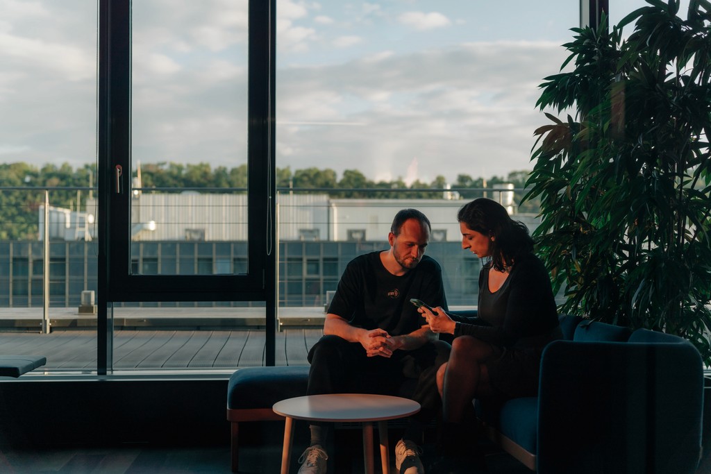 Close-up of a human eye illuminated by red light, symbolizing AI vision and digital innovation.