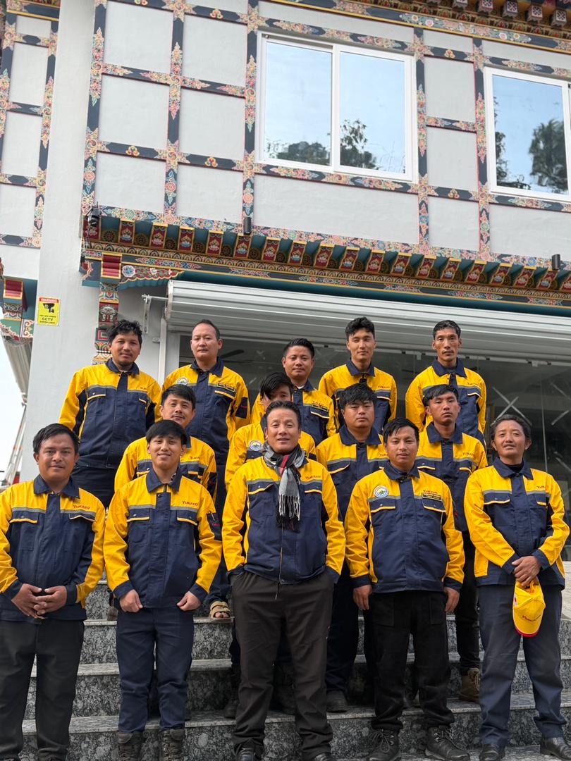 woman in blue long sleeve shirt wearing brown hat standing in corn field during daytime
