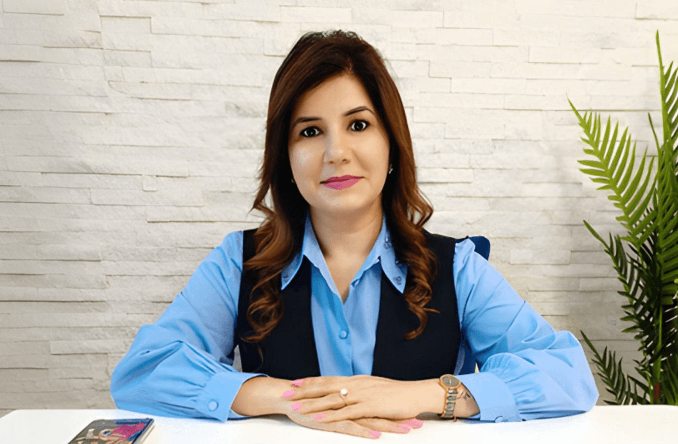 Portrait of Hope Founderz founder Tanu Chopra at a desk