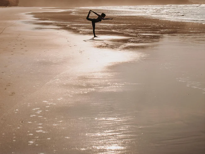 Yoga retreat combining daily classes with surf, kayaking or SUP, plus massage and half-board stays at a boutique hotel.