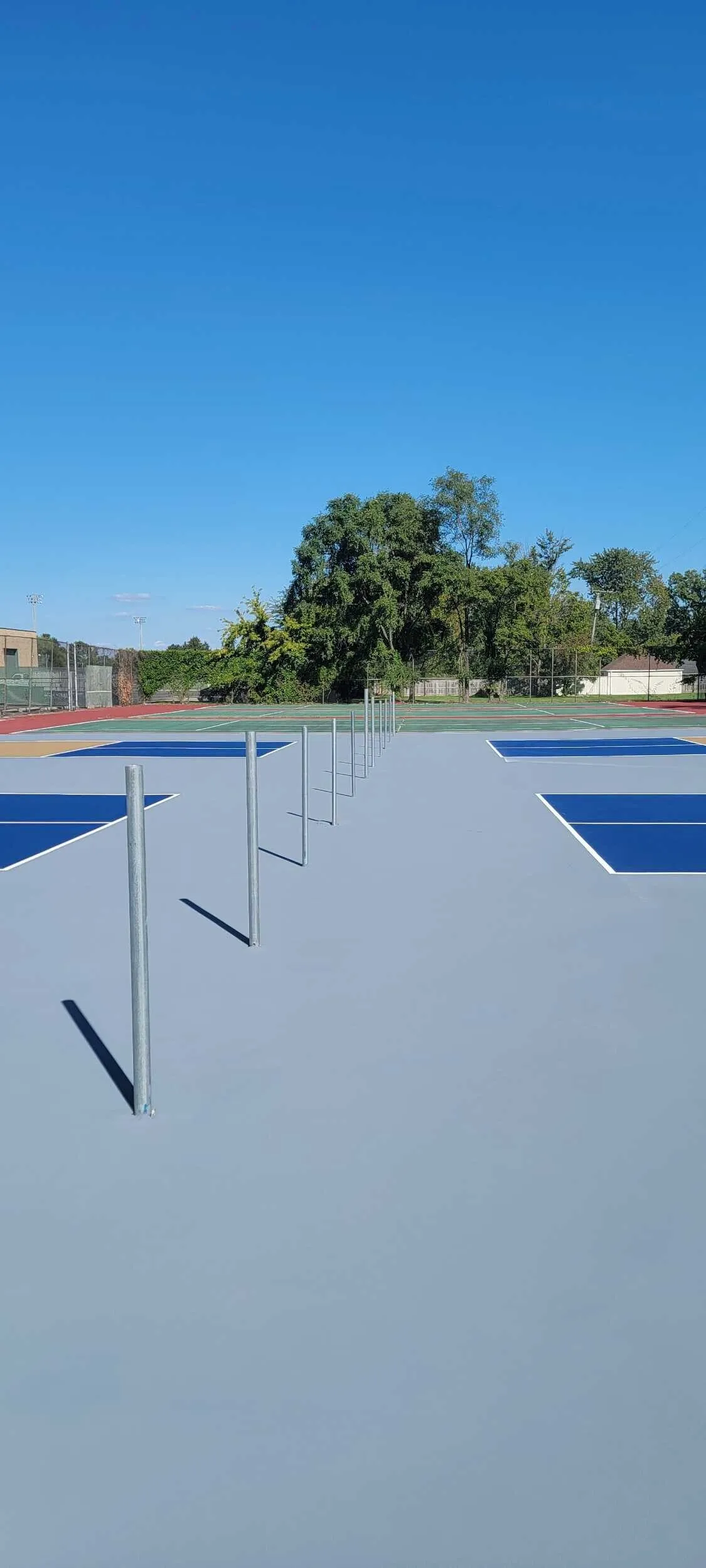 Six newly converted pickleball courts with fresh surfacing and net posts at Clintondale Community Schools