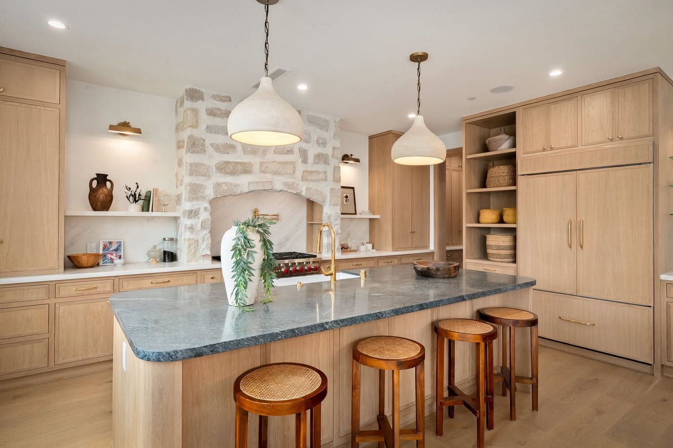 Warm interior styling detail with greenery and natural texture