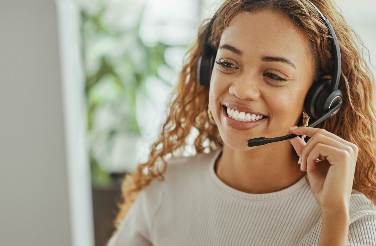 woman talking on the phone with a headset