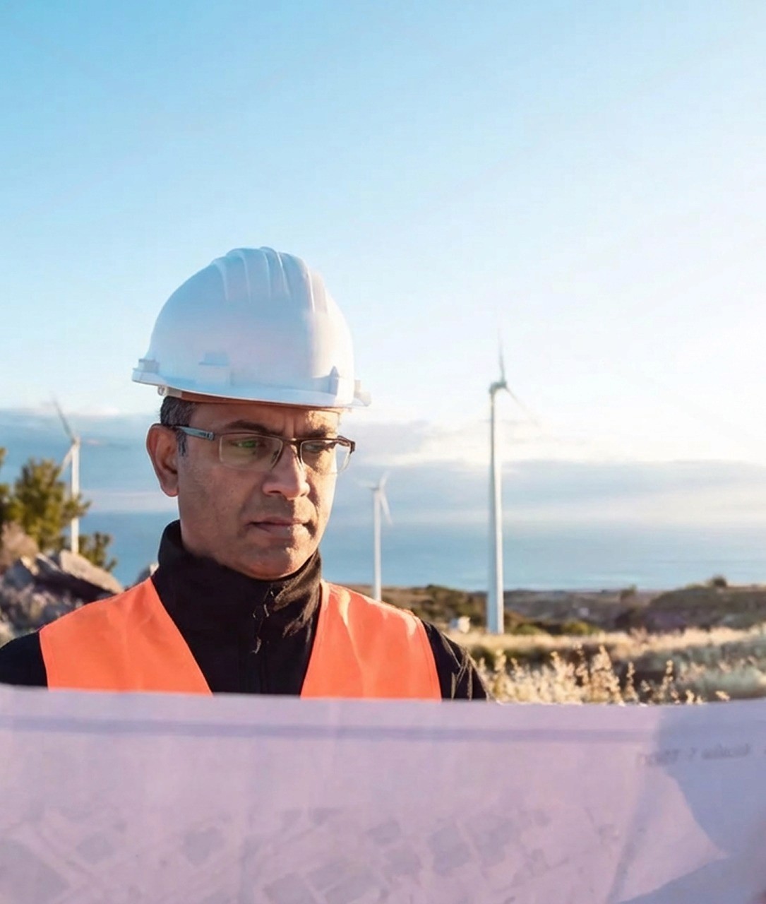 a factory building with a large smoke stack on top of it