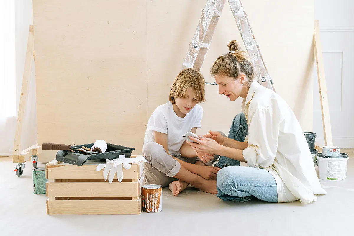 mother and son doing easy DIY project in their apartment