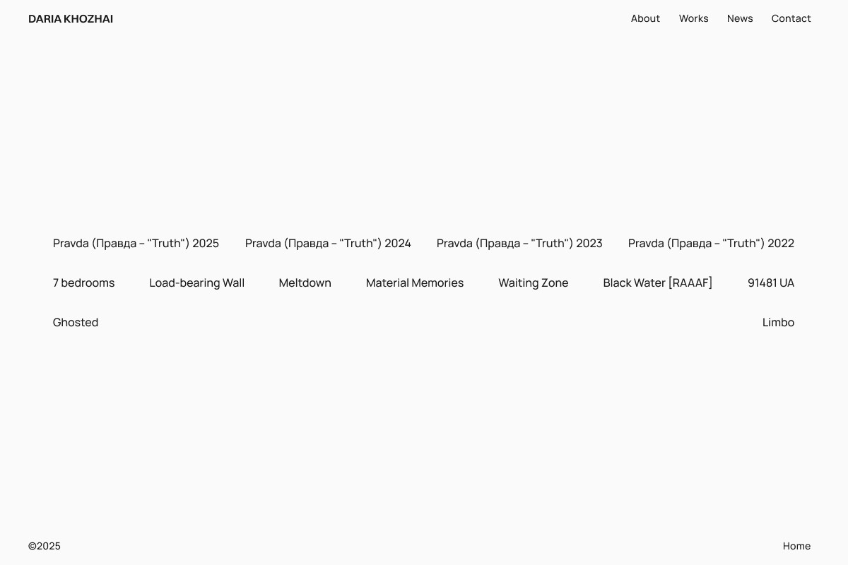 A hiker climbs a desert trail towards mountains.