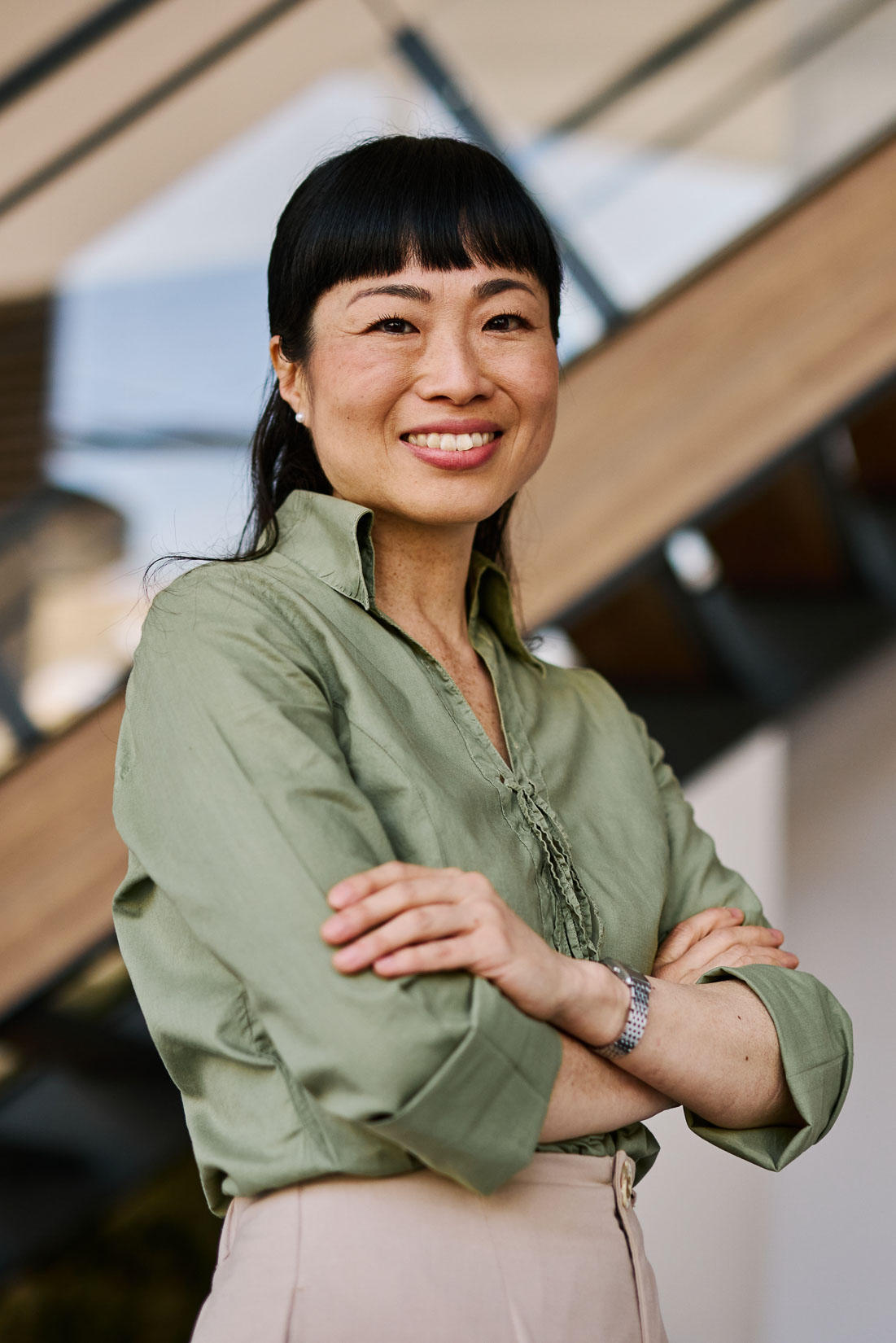 O-1 visa lawyer smiling in professional office