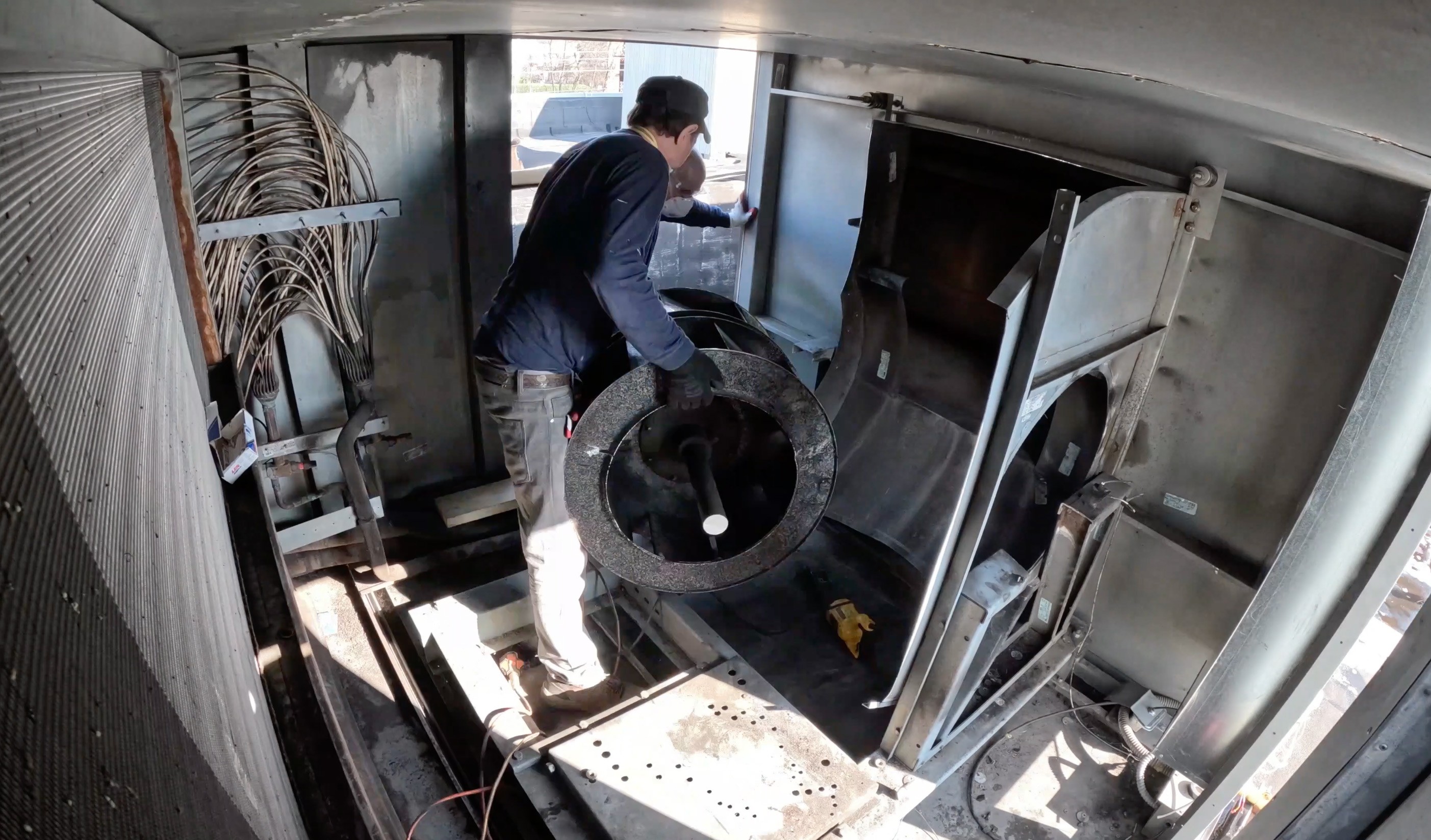 Removal of an existing legacy supply fan during an emergency HVAC retrofit by GRR Cooling Experts in a critical NYC healthcare environment