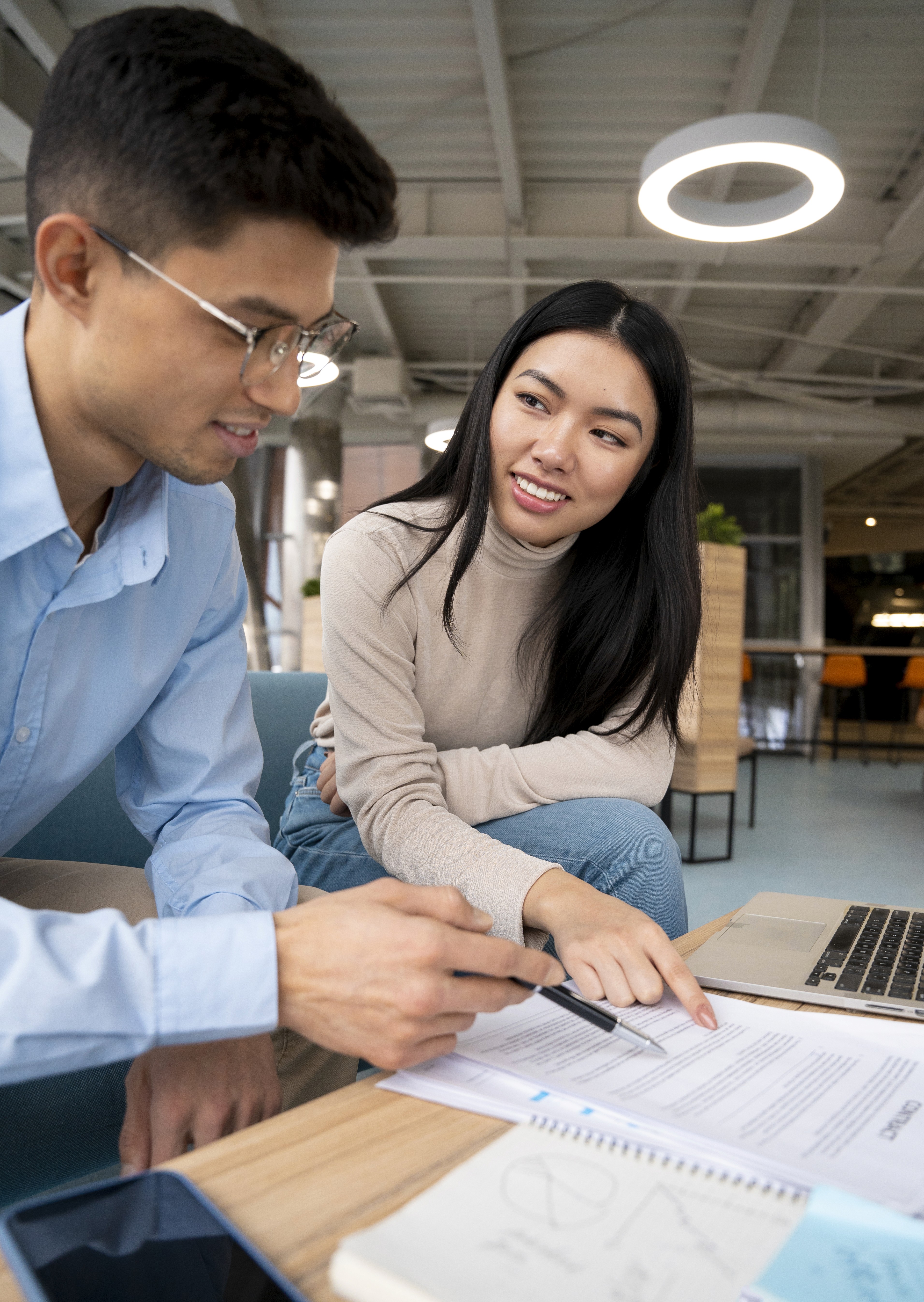 Abstract blurred motion of people working in a colorful office.