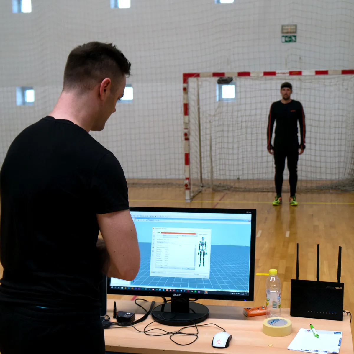 Calibrating Xsens motion capture while a goalkeeper in an Xsens suit stands in goal