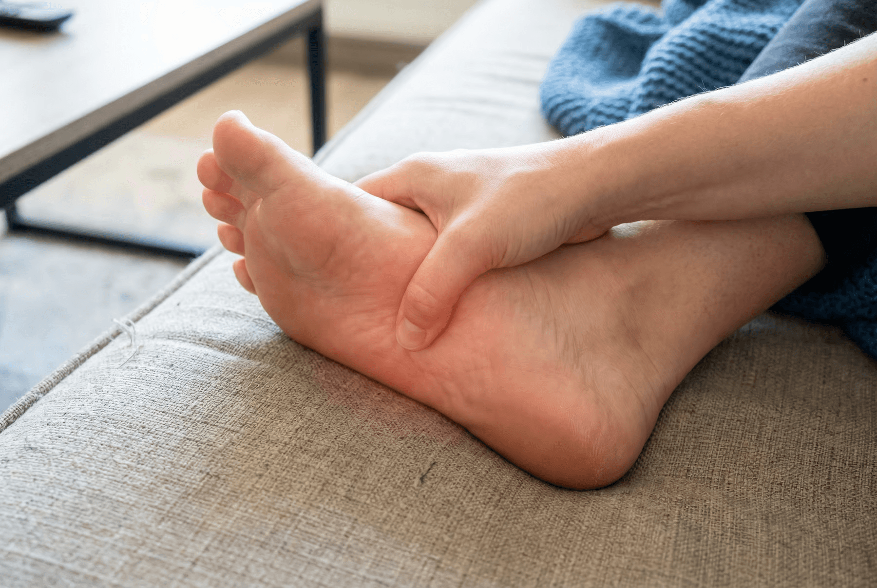 man kissing woman on check beside body of water