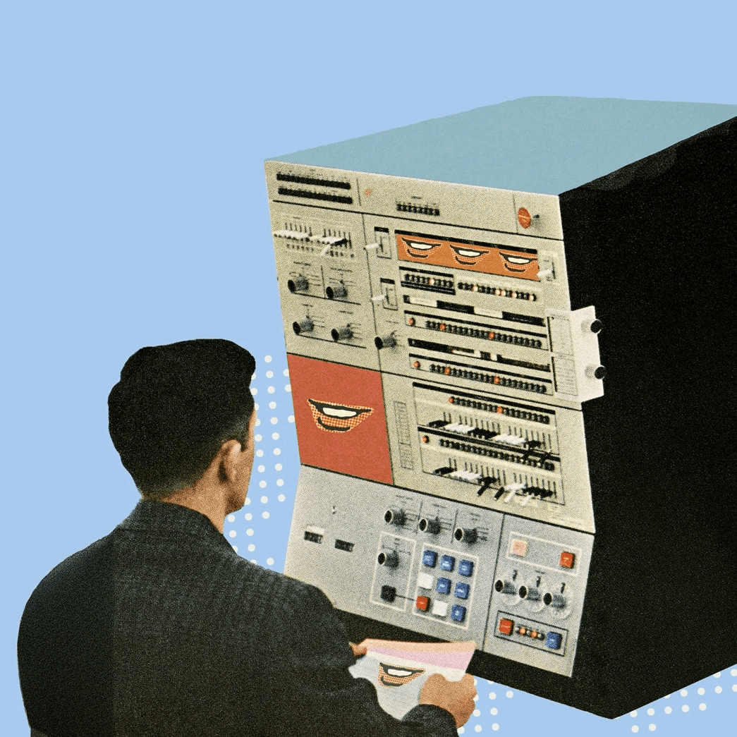 Hombre frente a computadora retro de control mecánico y palancas.