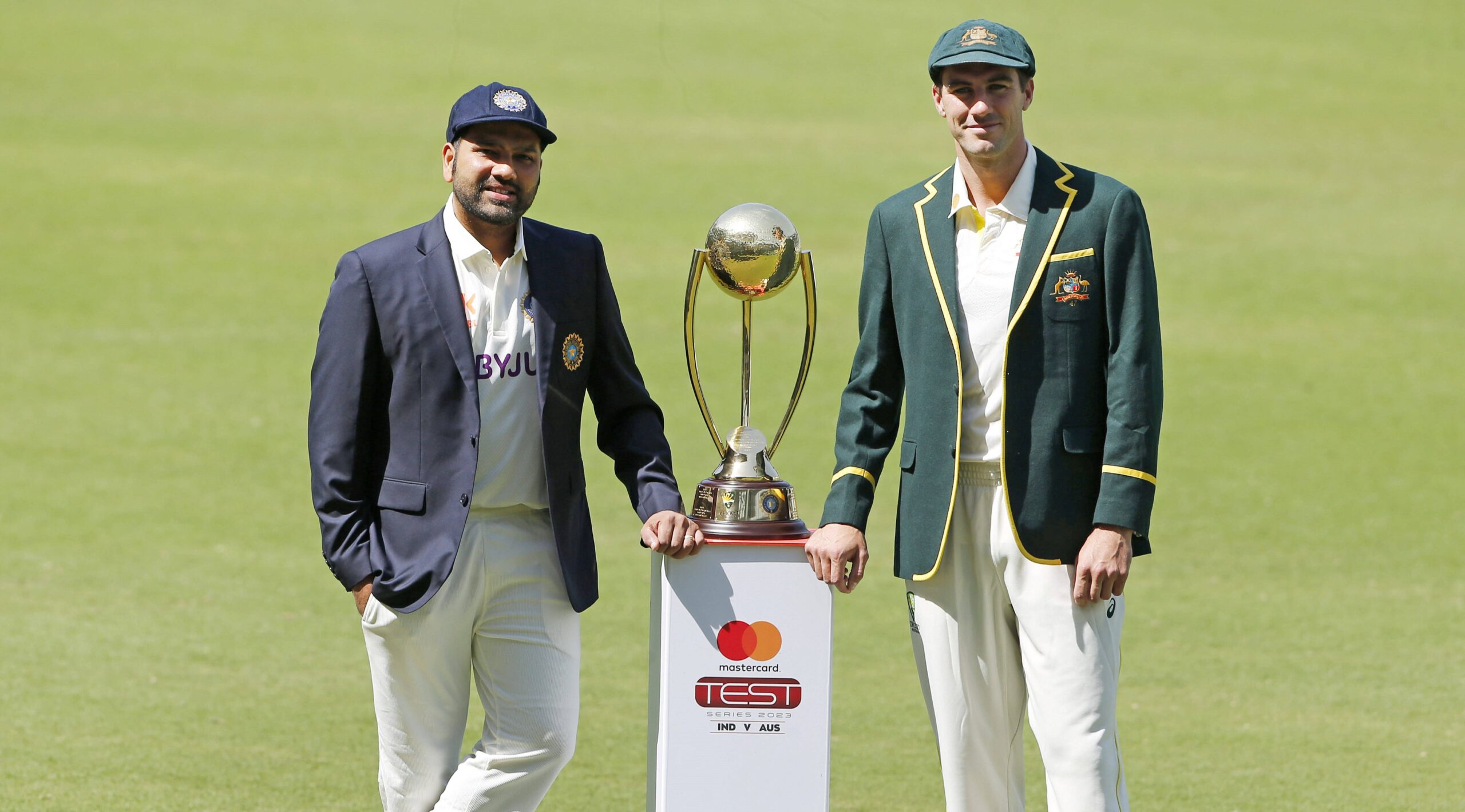 Rohit and Cummins Posing with Trophy