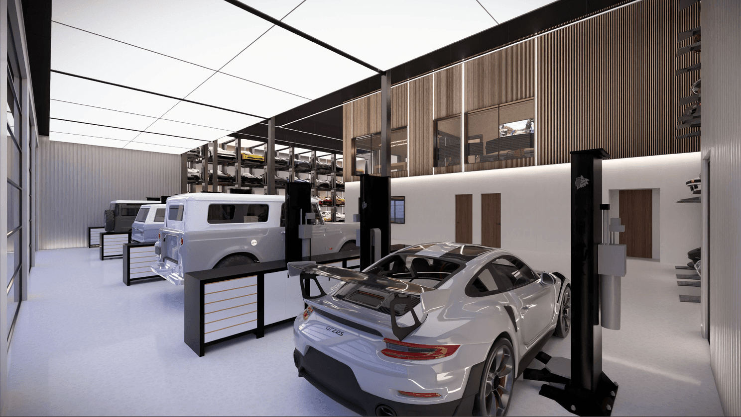 Interior shot of back or workshop in eveso bozeman, showing cars on the workshop lifts, clean, beautiful, thoughtfully designed, attention to detail