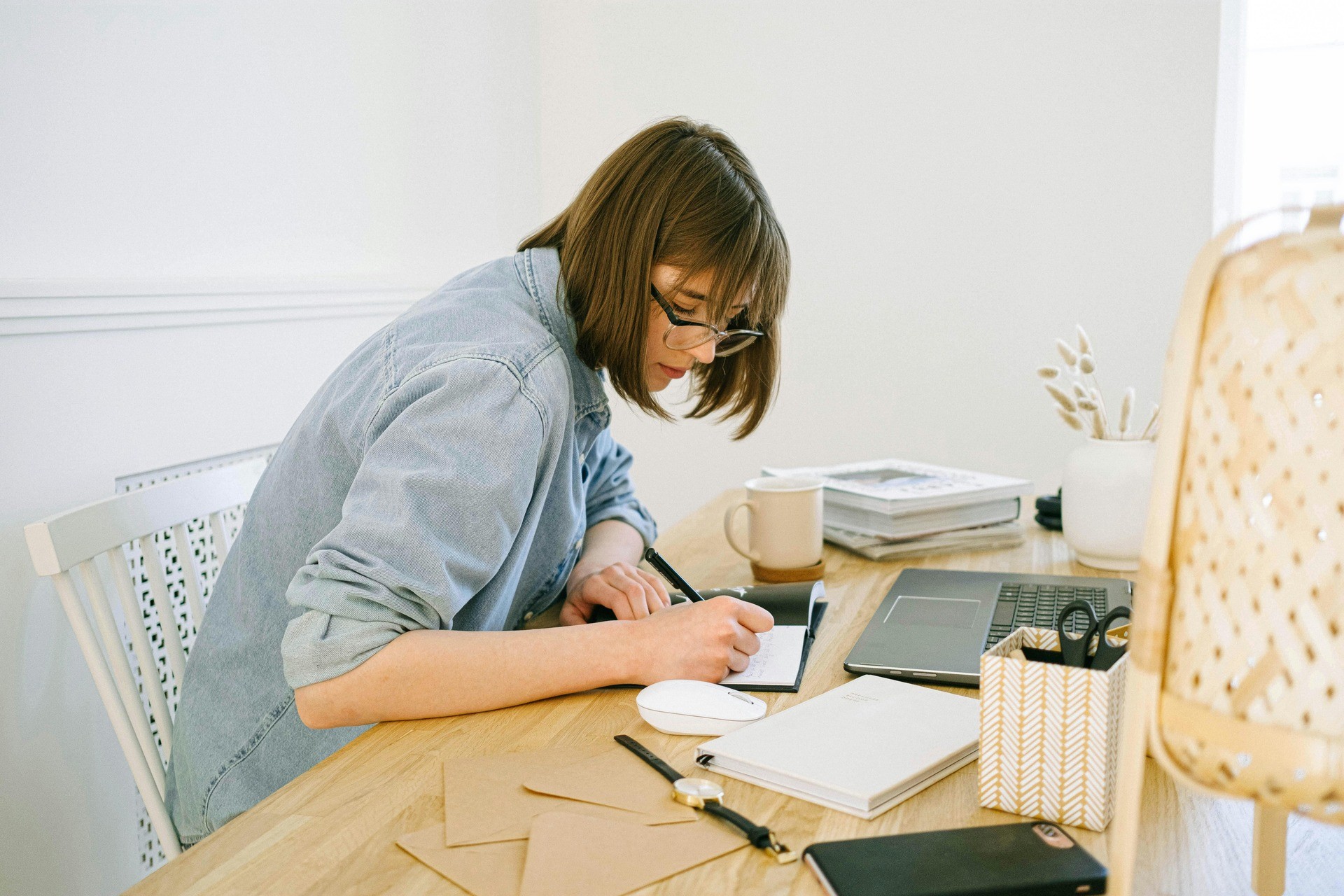 woman writing - What Is The Implications Section Of A Research Paper
