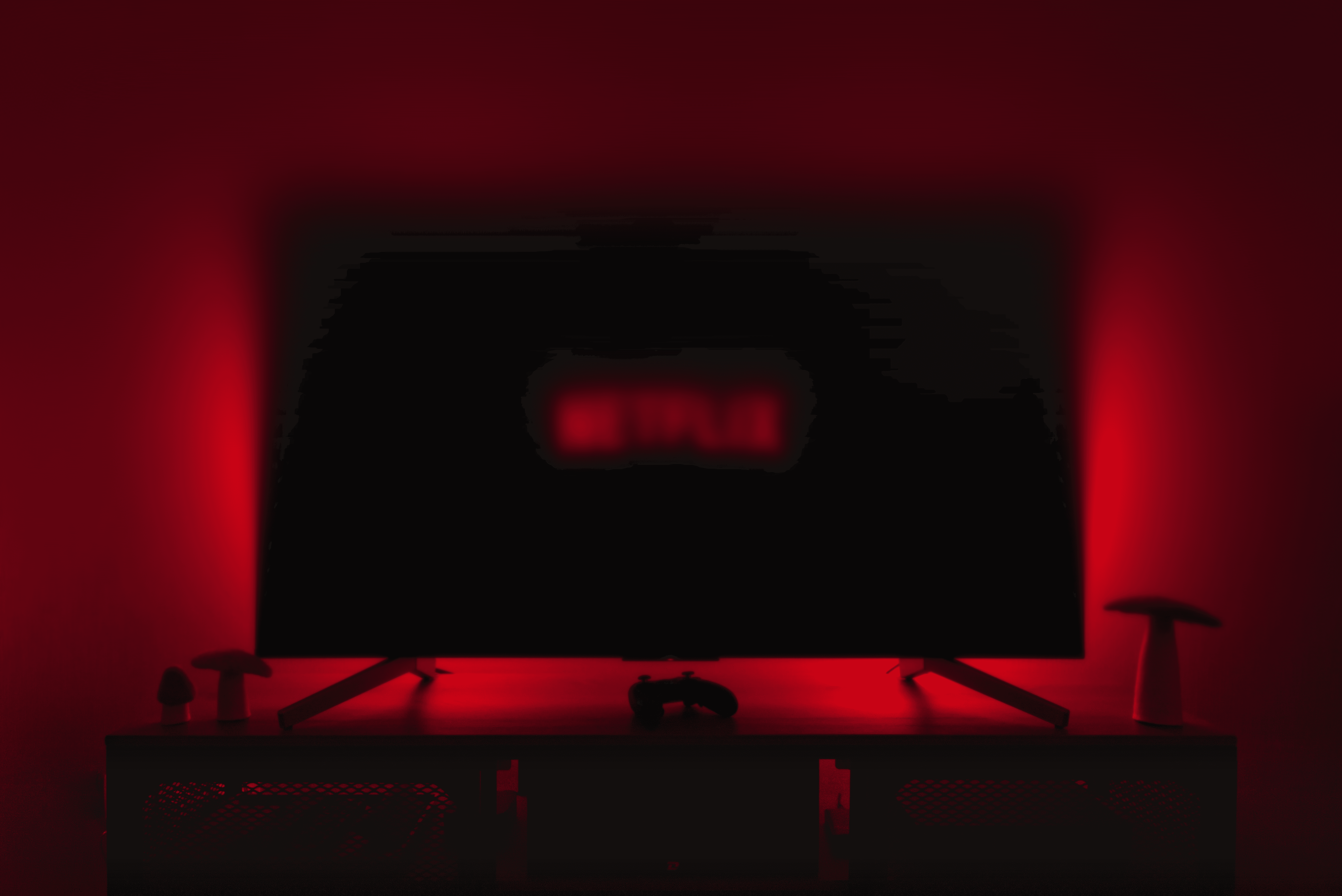 a television with the netflix logo lit up in the dark