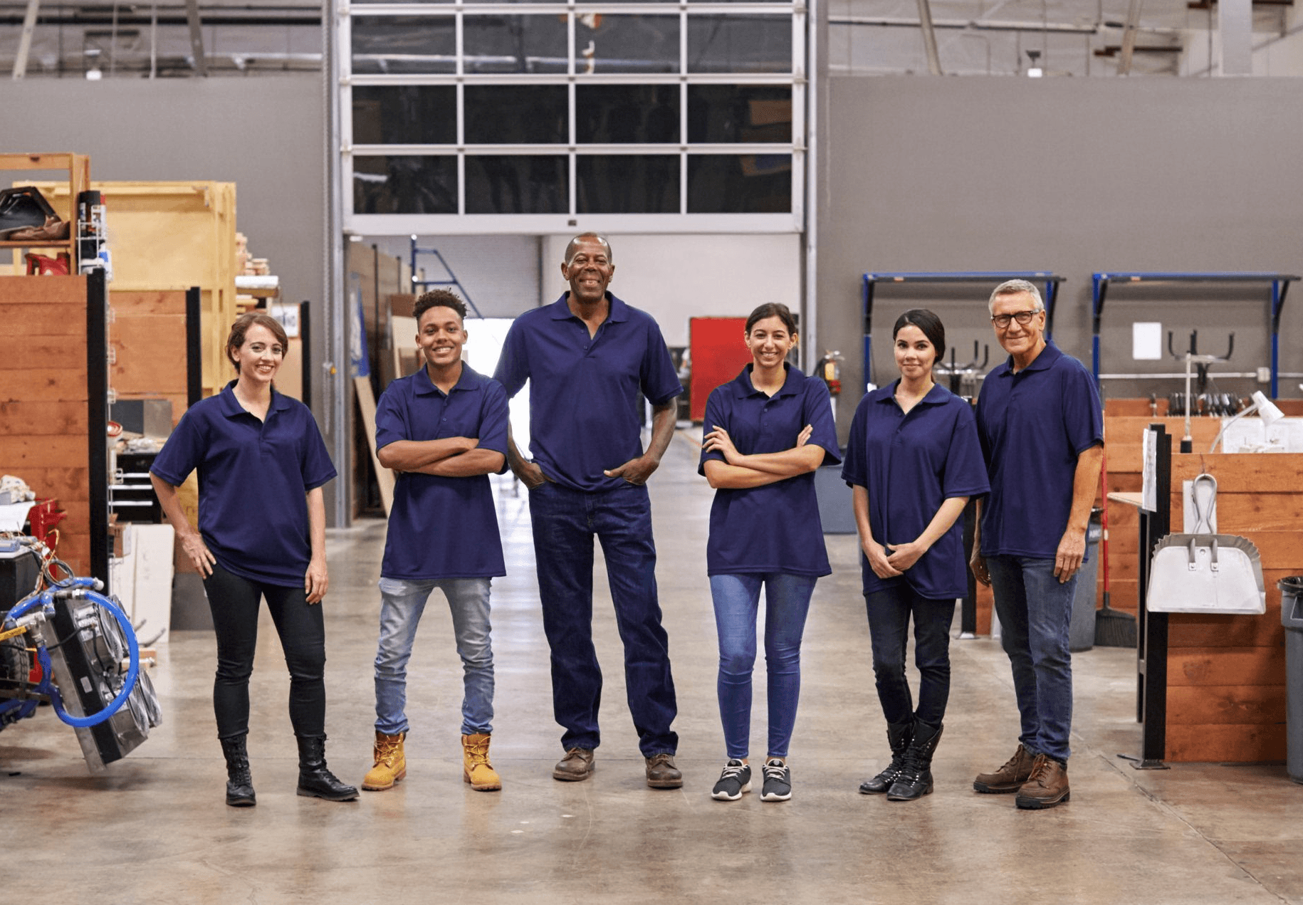 The Millbrook team standing together in the workshop