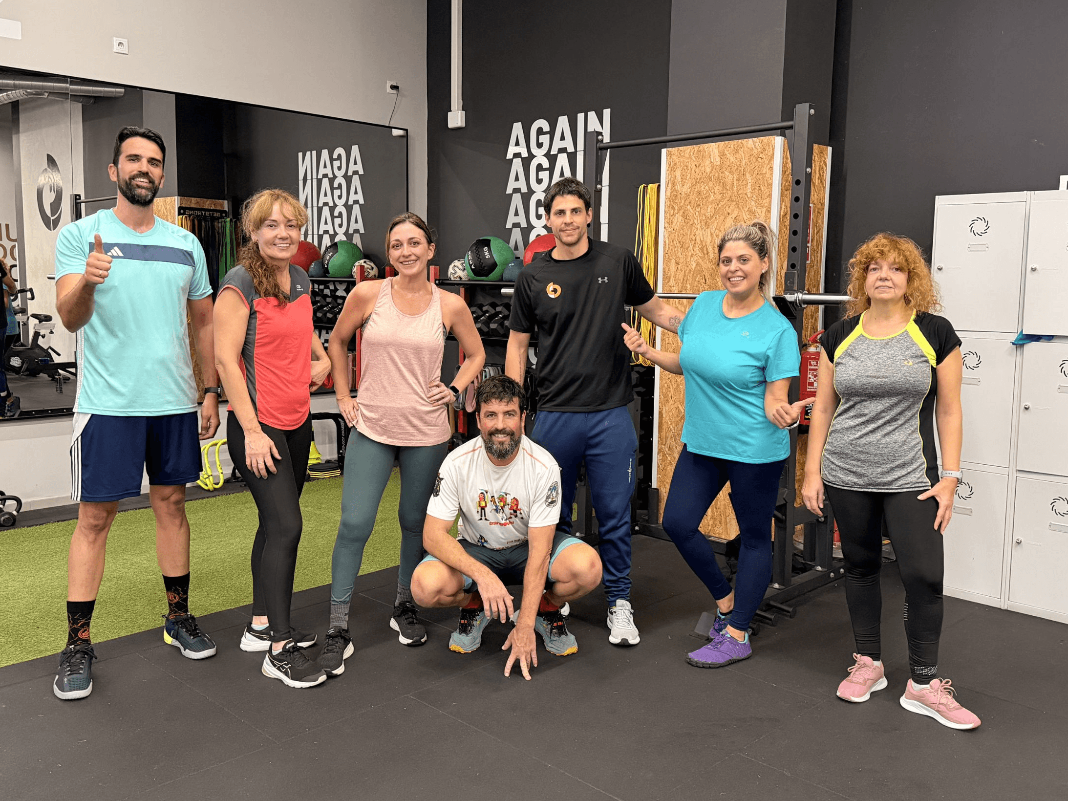 man in black shorts and black tank top doing push up