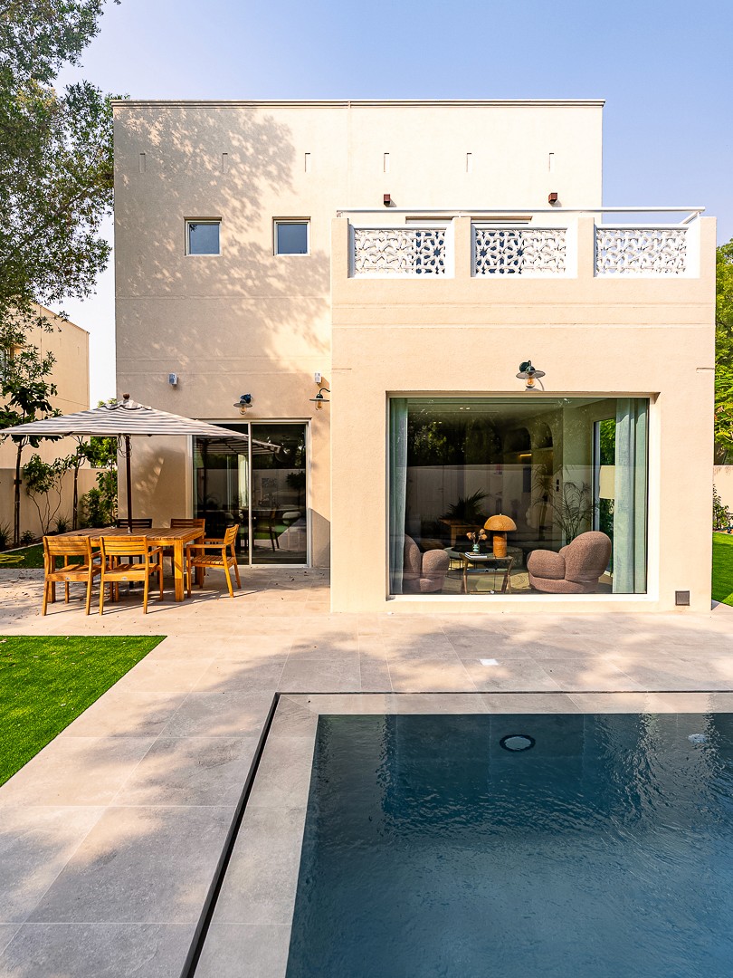 Image of a large villa with big glass windows