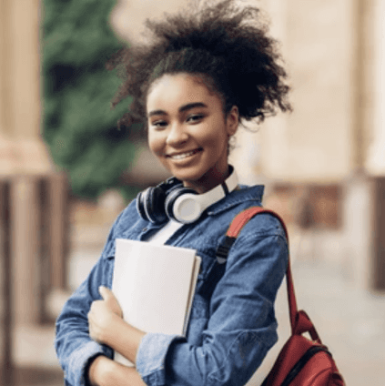 Girl holding books and wearing a backpack