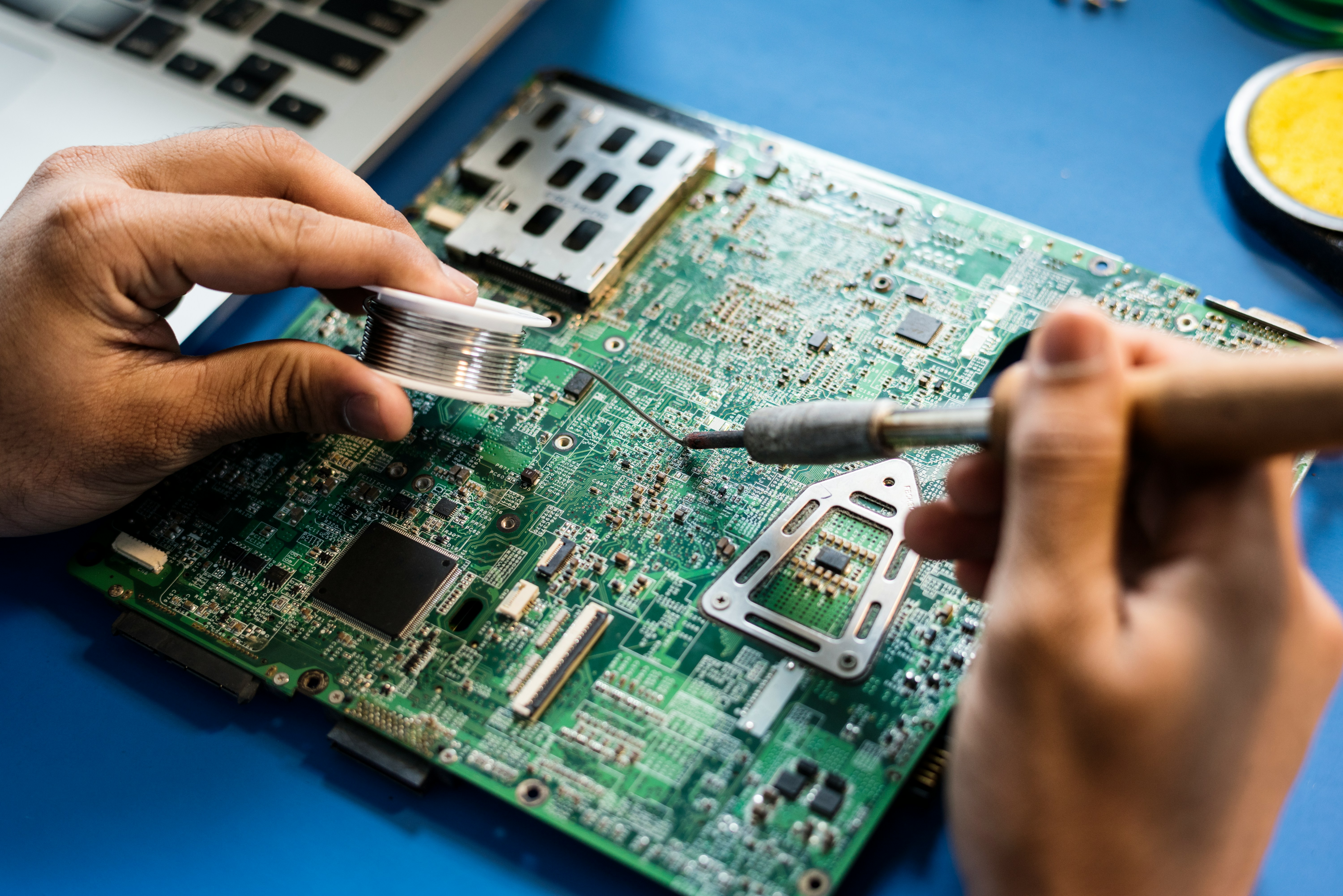 Engineer working closely with electrical equipment protected with ESD safety