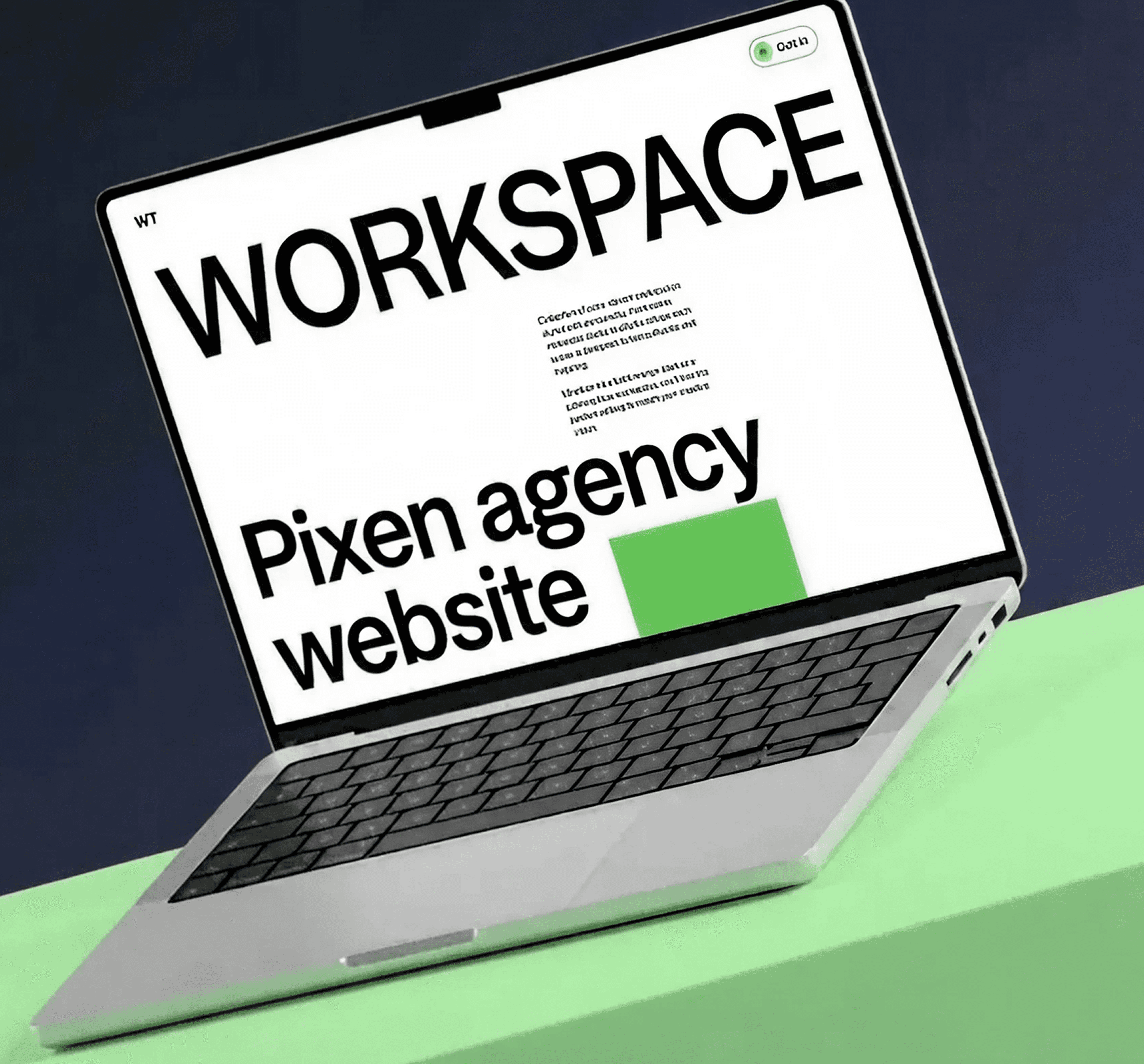 Laptop on green surface displaying 'WT Workspace Pixen agency website' interface