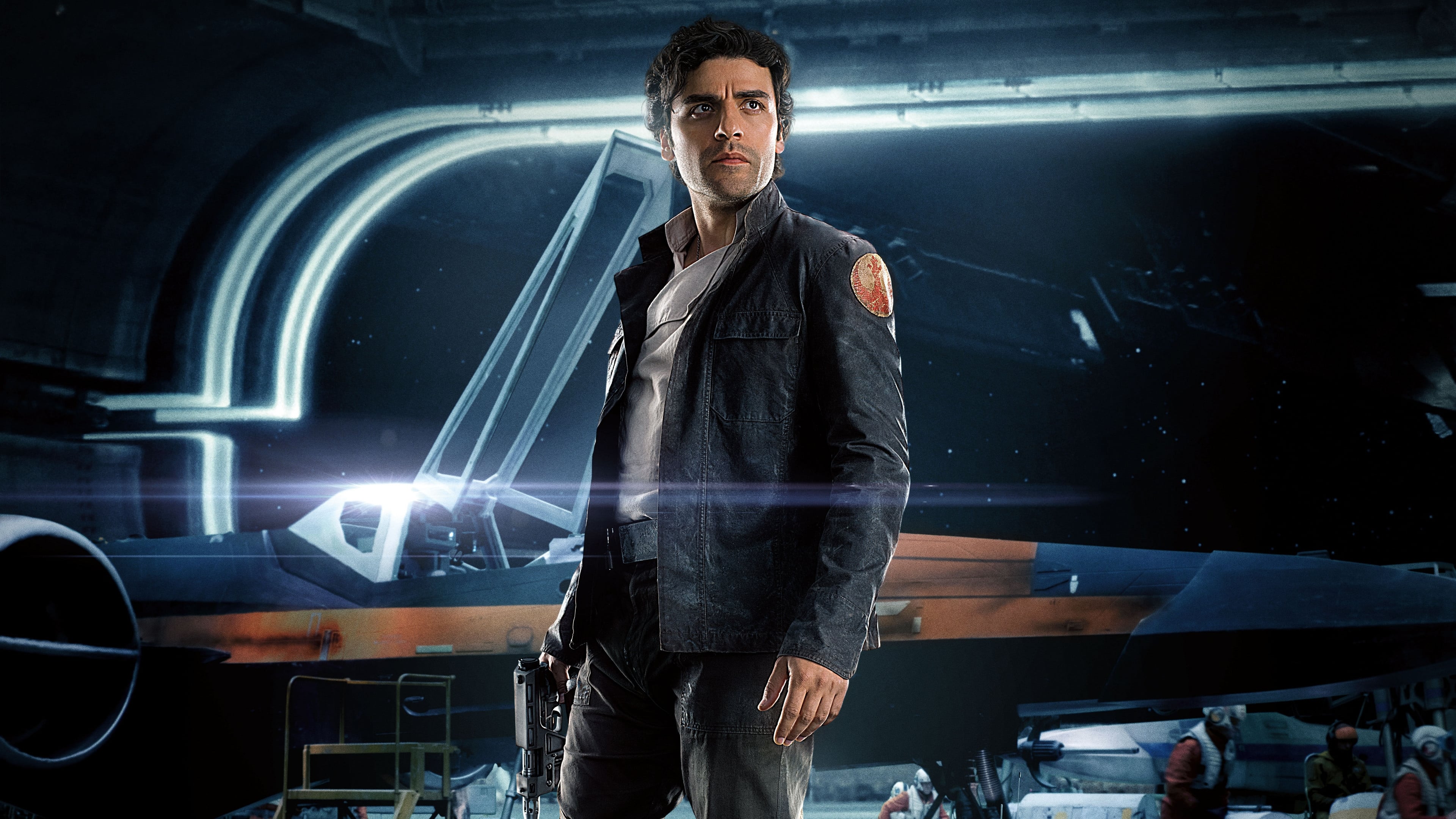 A man stands confidently in a futuristic hangar. He wears a dark jacket and holds a blaster. Behind him, a sleek, dark spacecraft is visible, with blurred crew members in the background. The scene is dramatic and sci-fi themed.