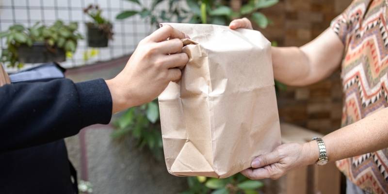 A woman receiving her food delivery
