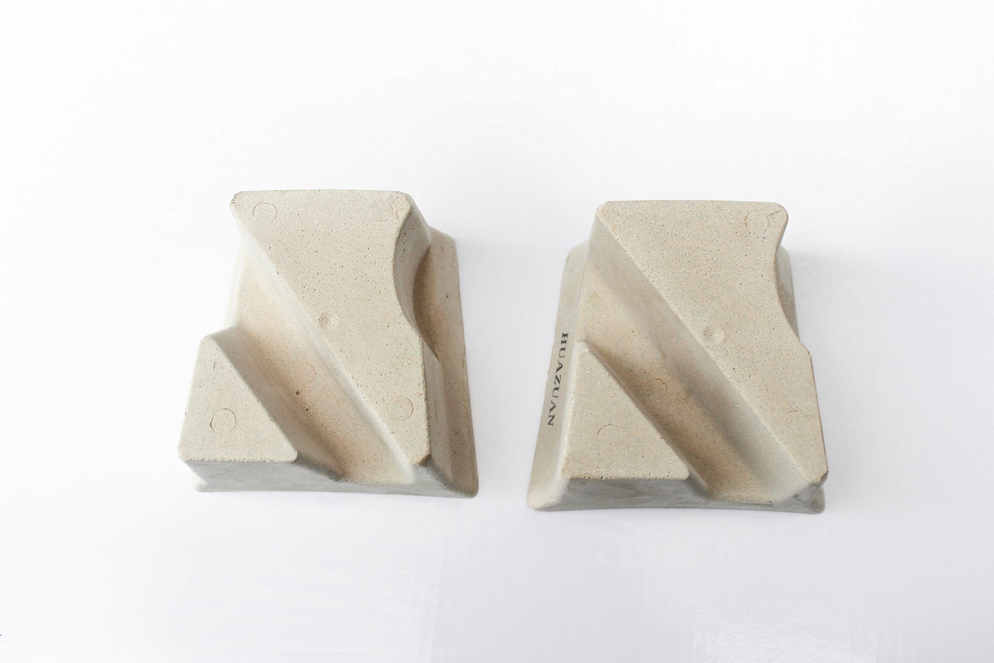 Two resin bond diamond fickerts placed side by side, viewed from the top to display the texture and design of the tool.