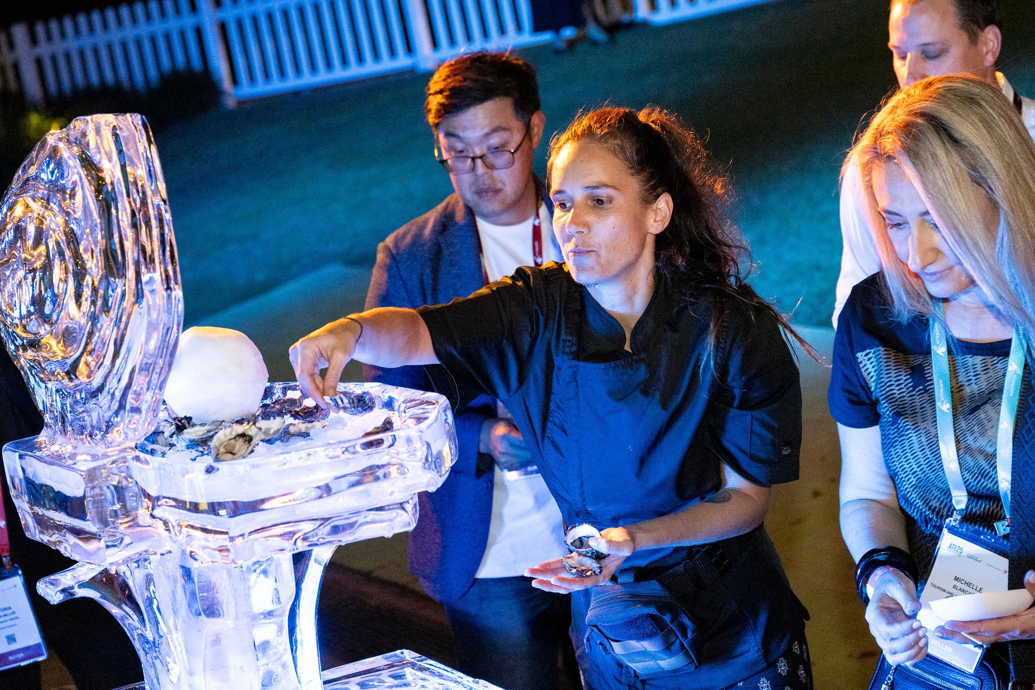 Tanika from Nooks & Cooks replenishing the oyster station