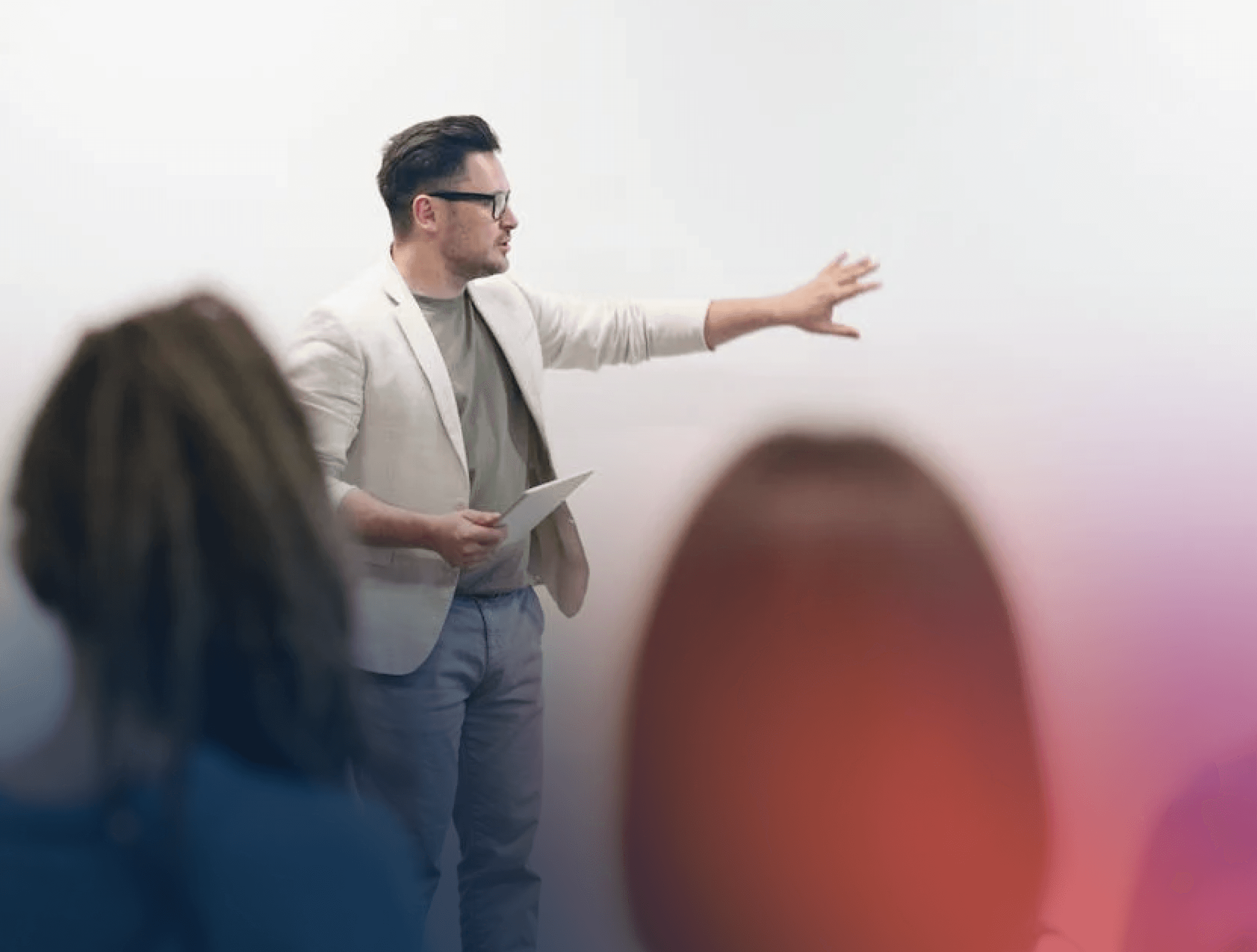 Man in smart casual presenting