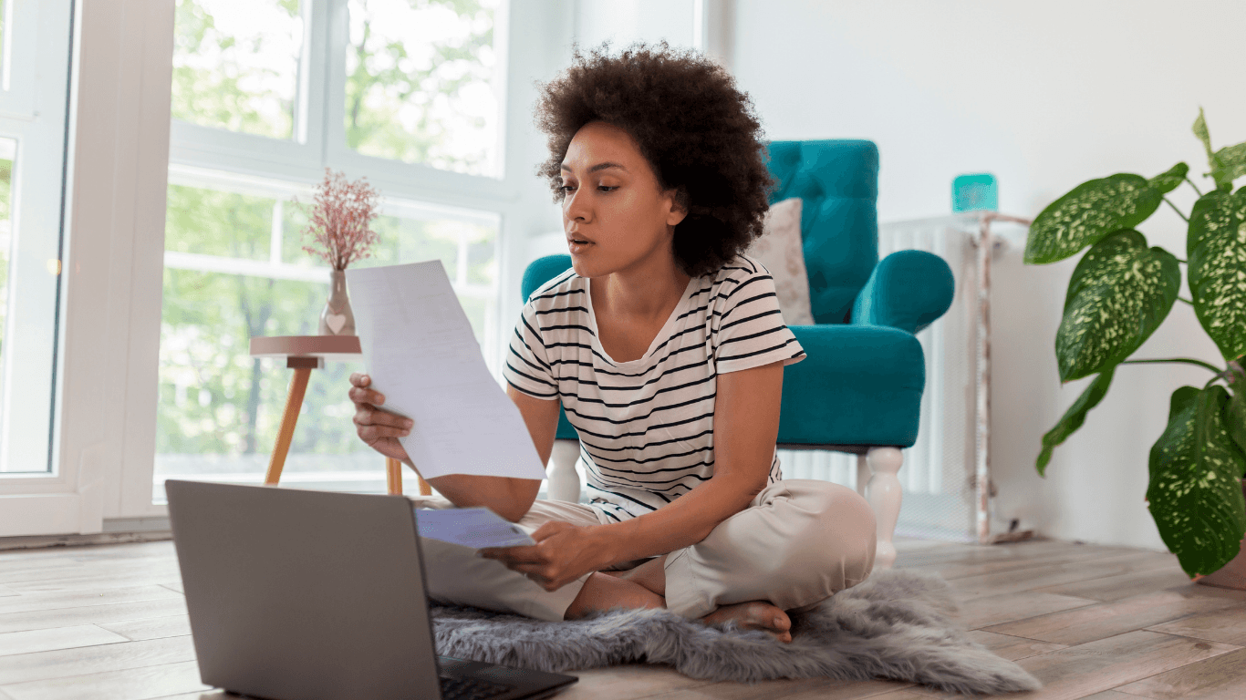 person managing their expenses on a laptop