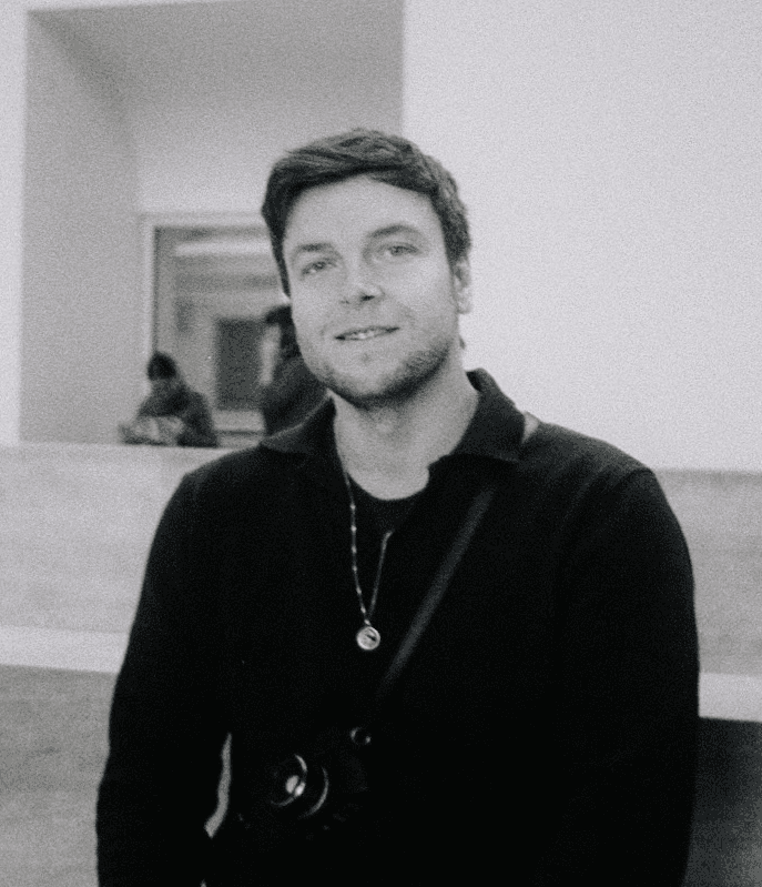 Man wearing white bunny hat with fake glasses and mustache design.