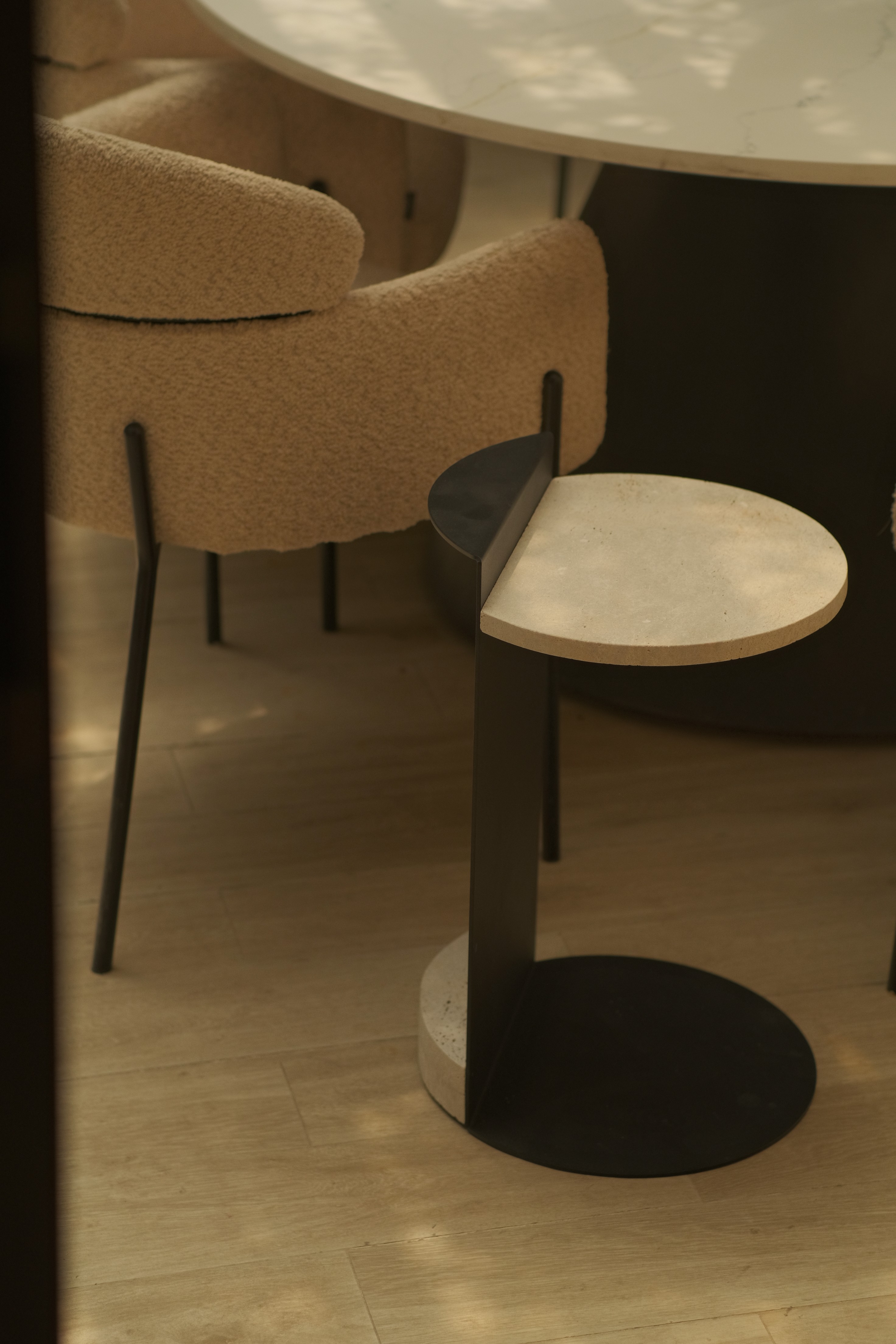 A moody scene of a room with a lamp shade