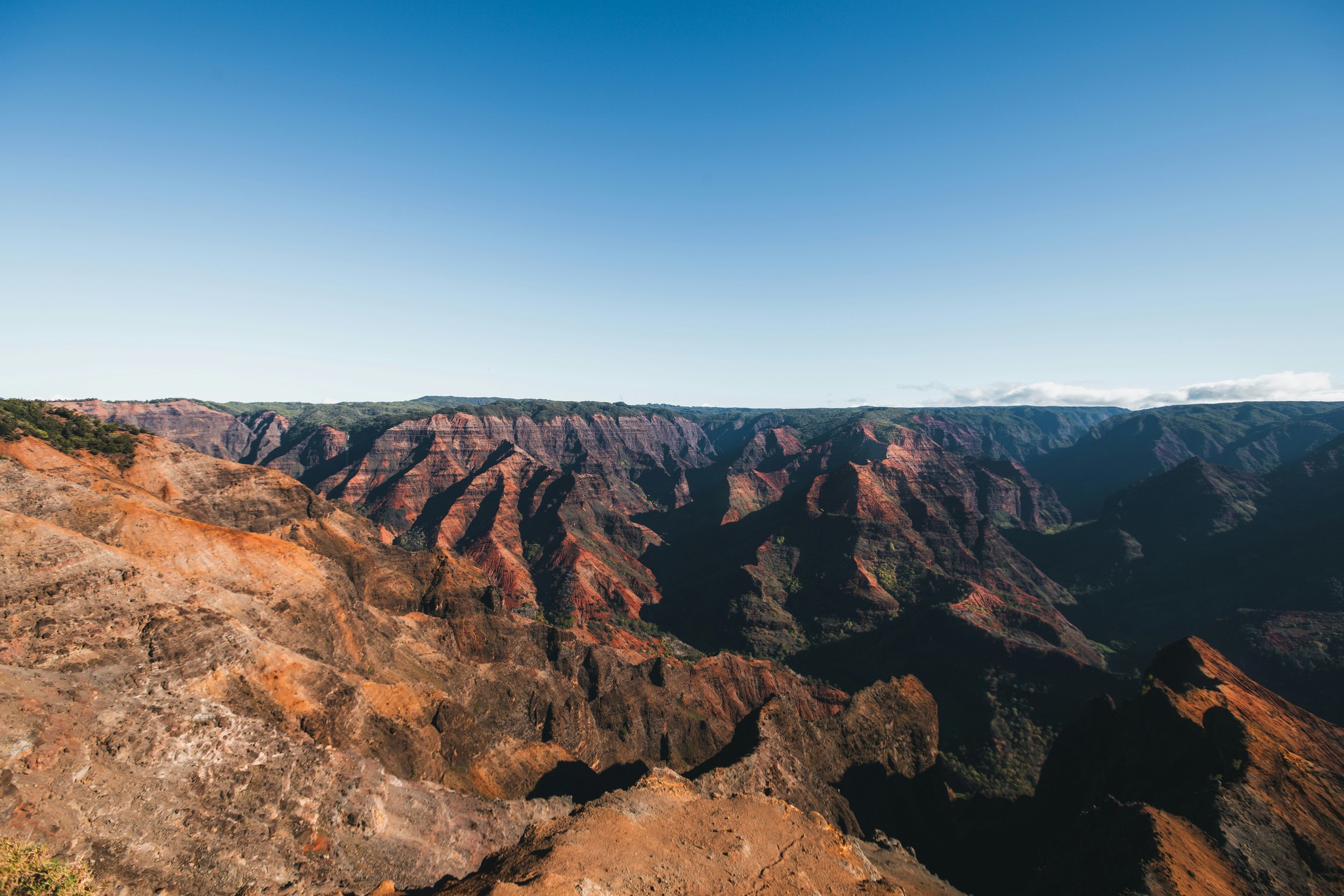 a rocky canyon with blue sky