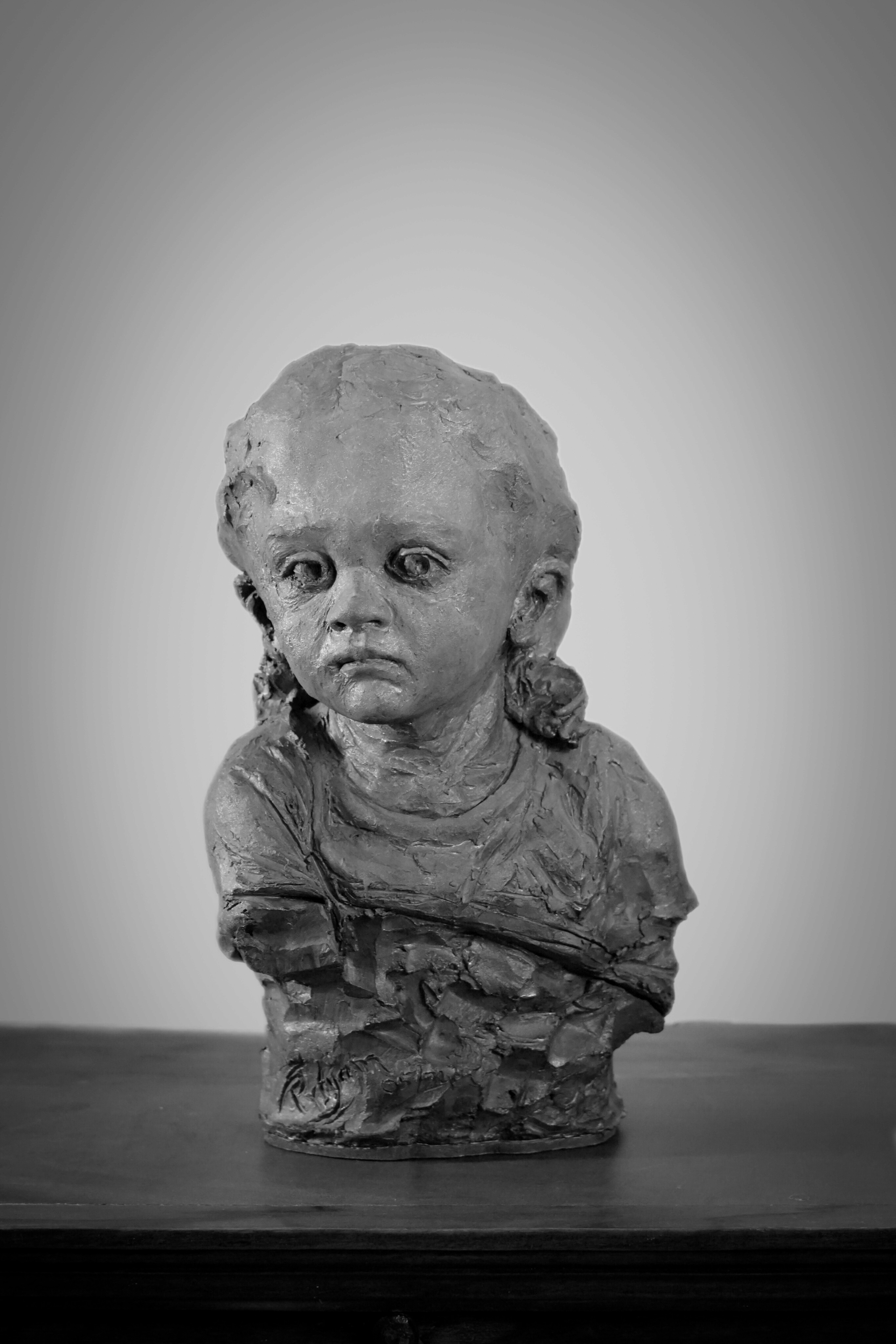 portrait sculpture of a young child