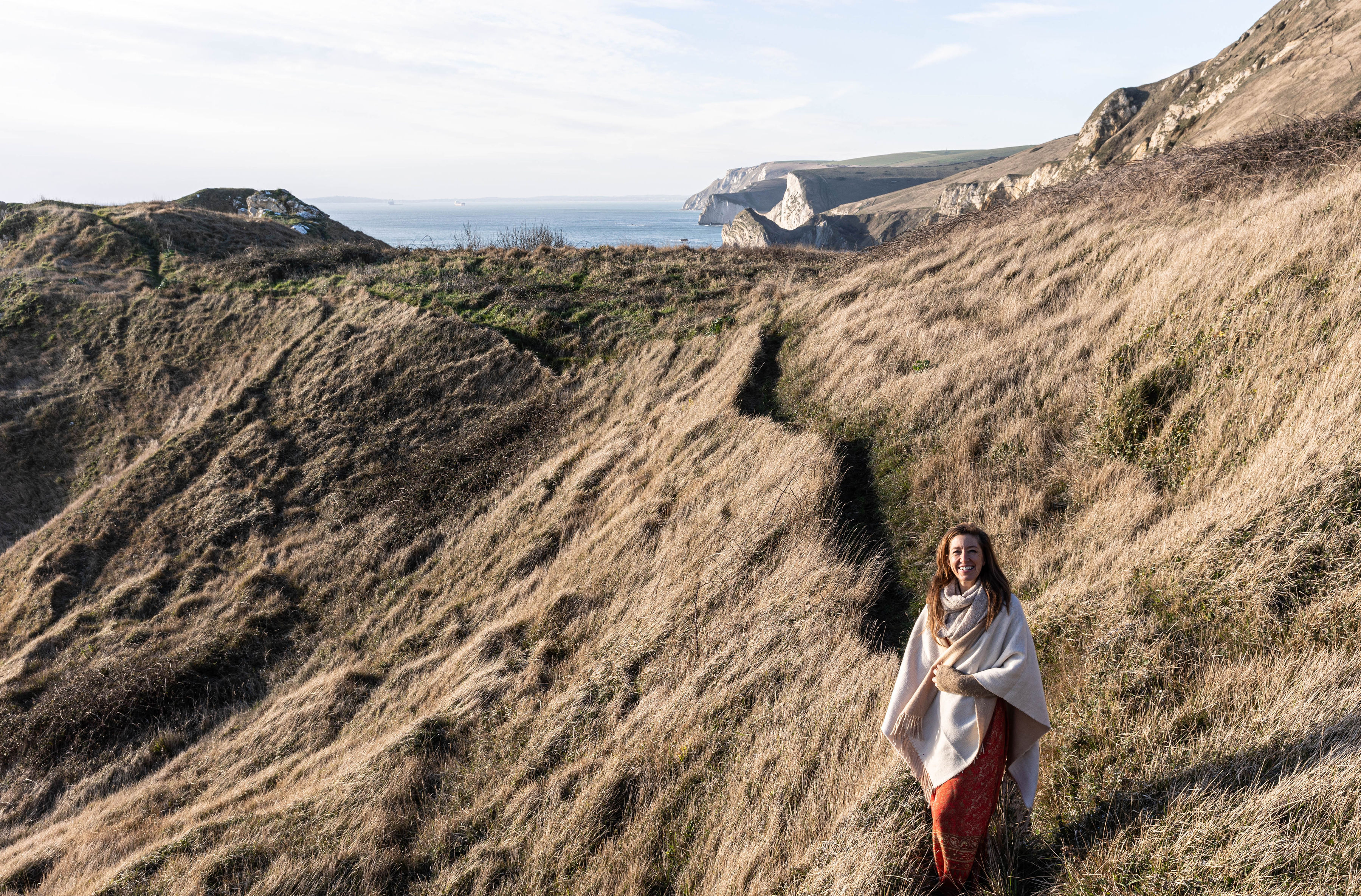 woman walking on the cliff