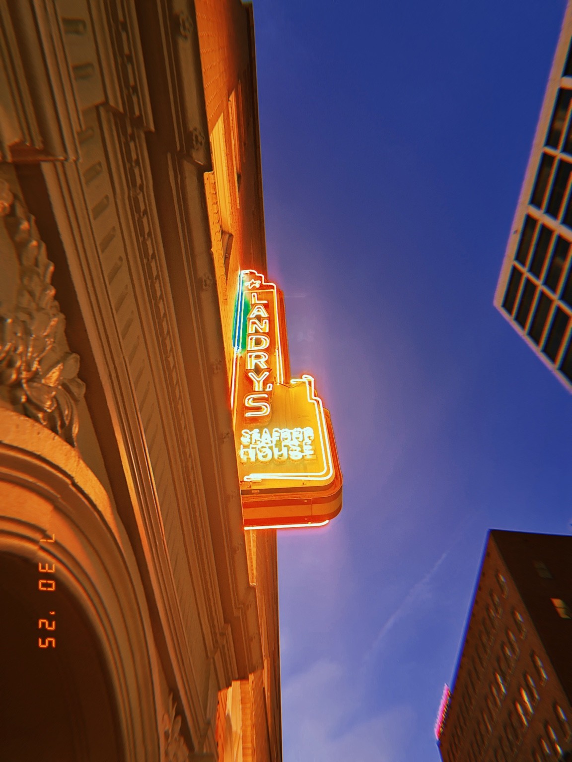Landry’s illuminated neon sign Photograph by Pranjali Shah.