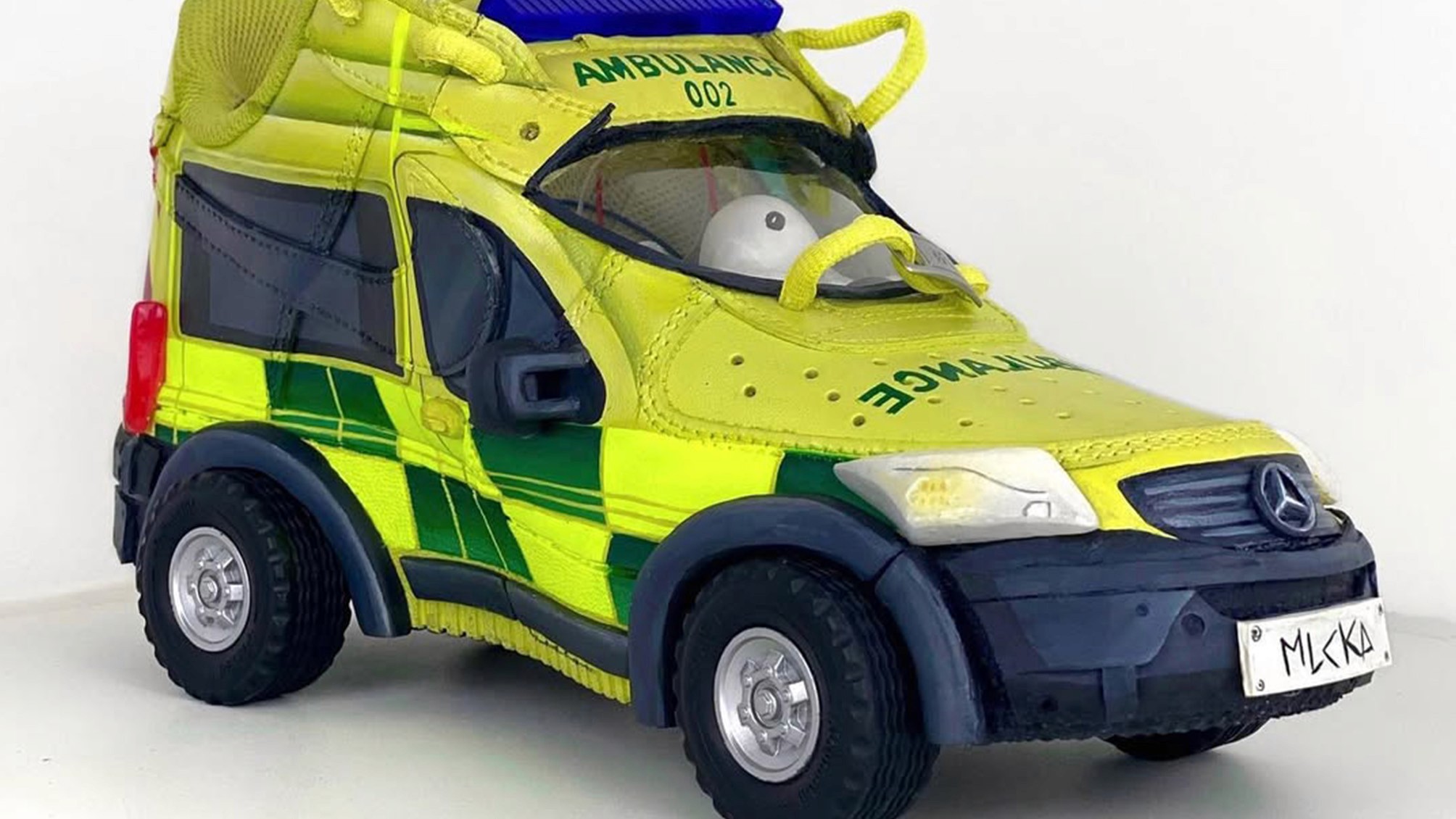 Sculpture of a sneaker ambulance.