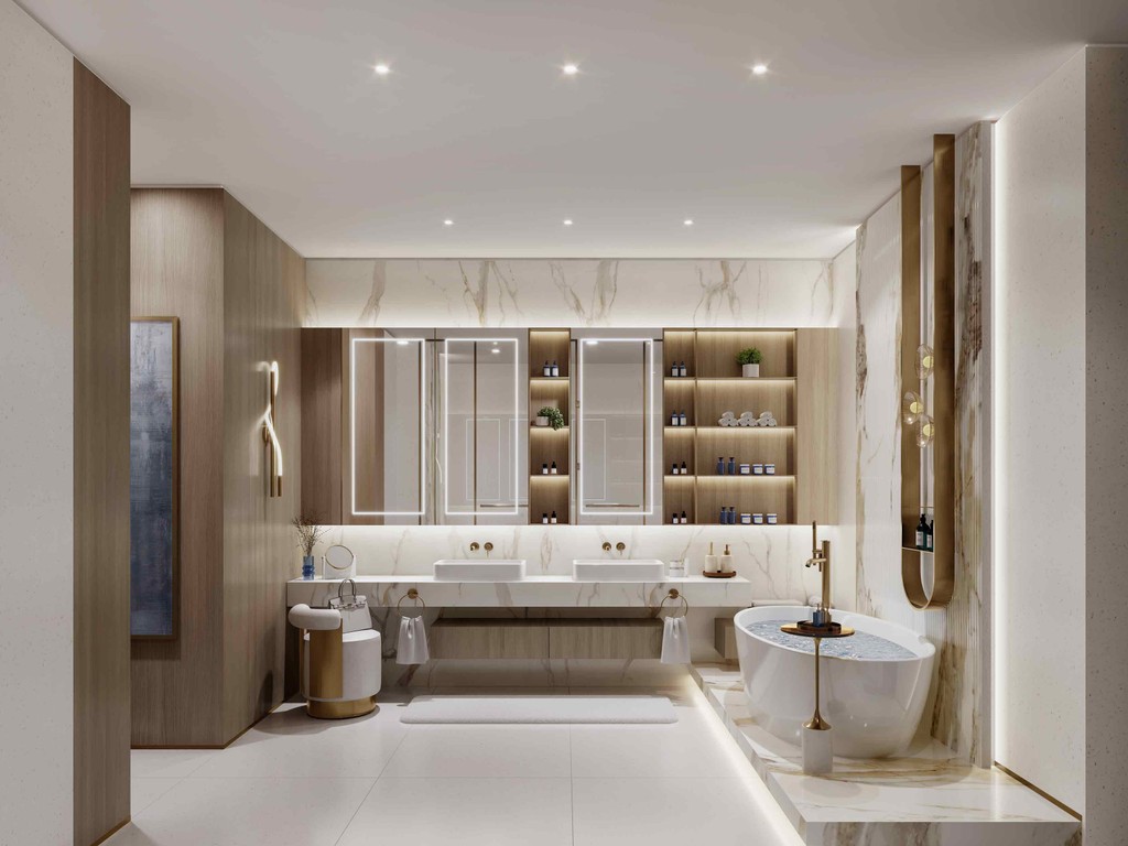 Contemporary bathroom design at Sunset Bay Grand, showcasing marble walls and a stylish tub.