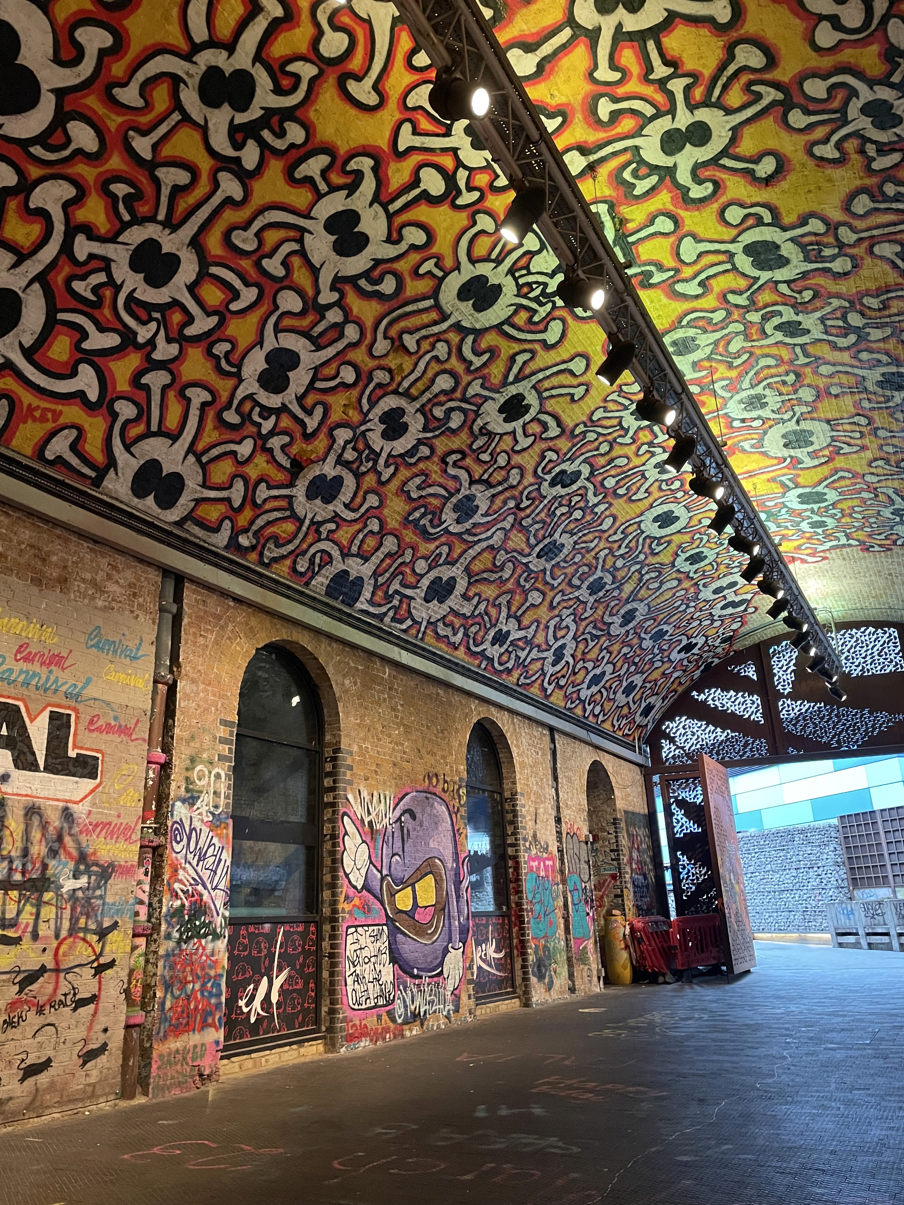 brown wooden lounger near body of water