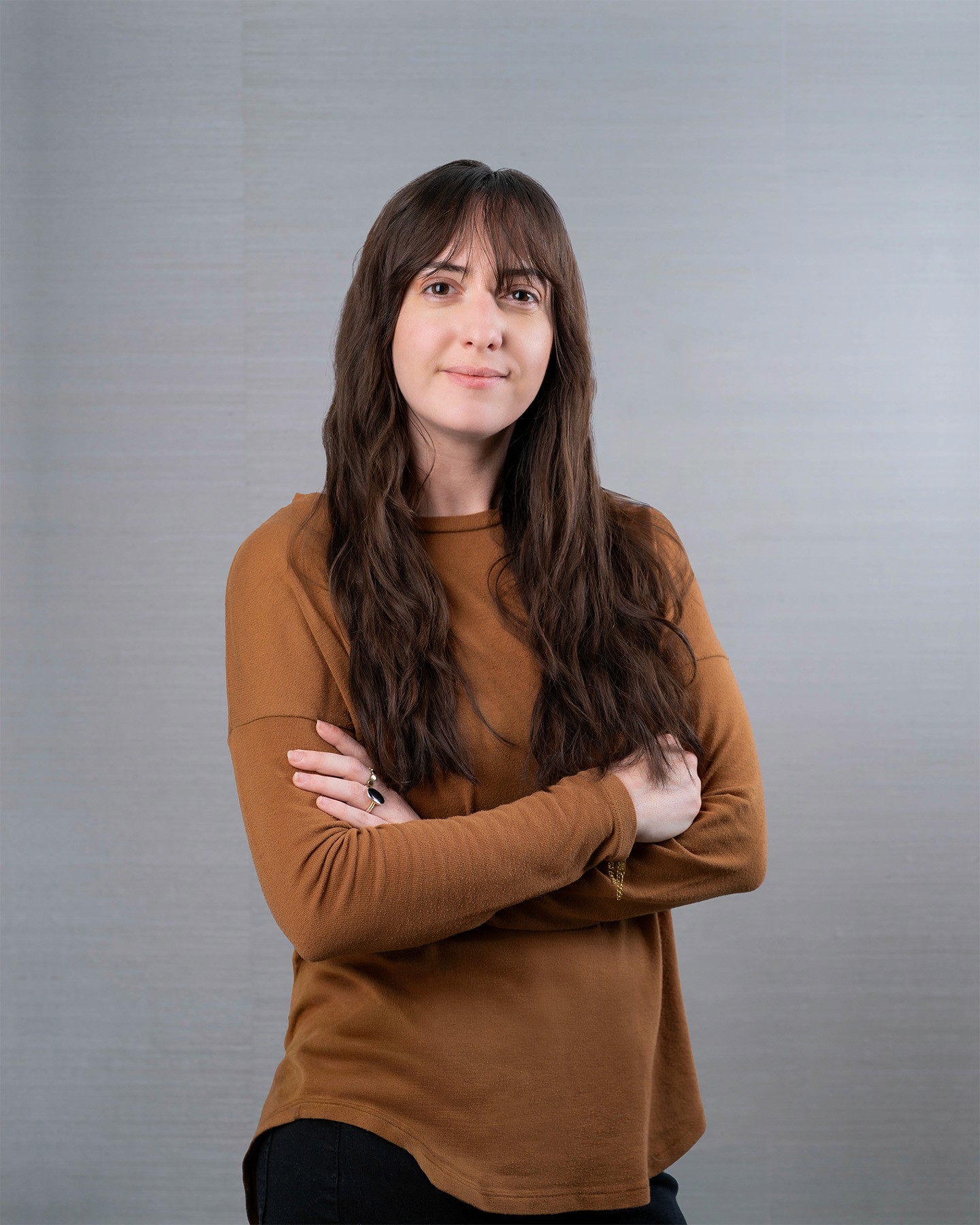 Young woman with long brown hair.