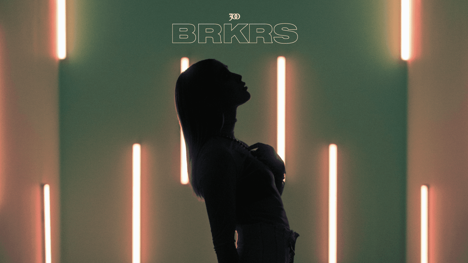 A silhouette of a woman standing in front of vertical neon lights with "BRKRS" and "300" logo above her, set against a moody green background, emphasizing introspection and identity