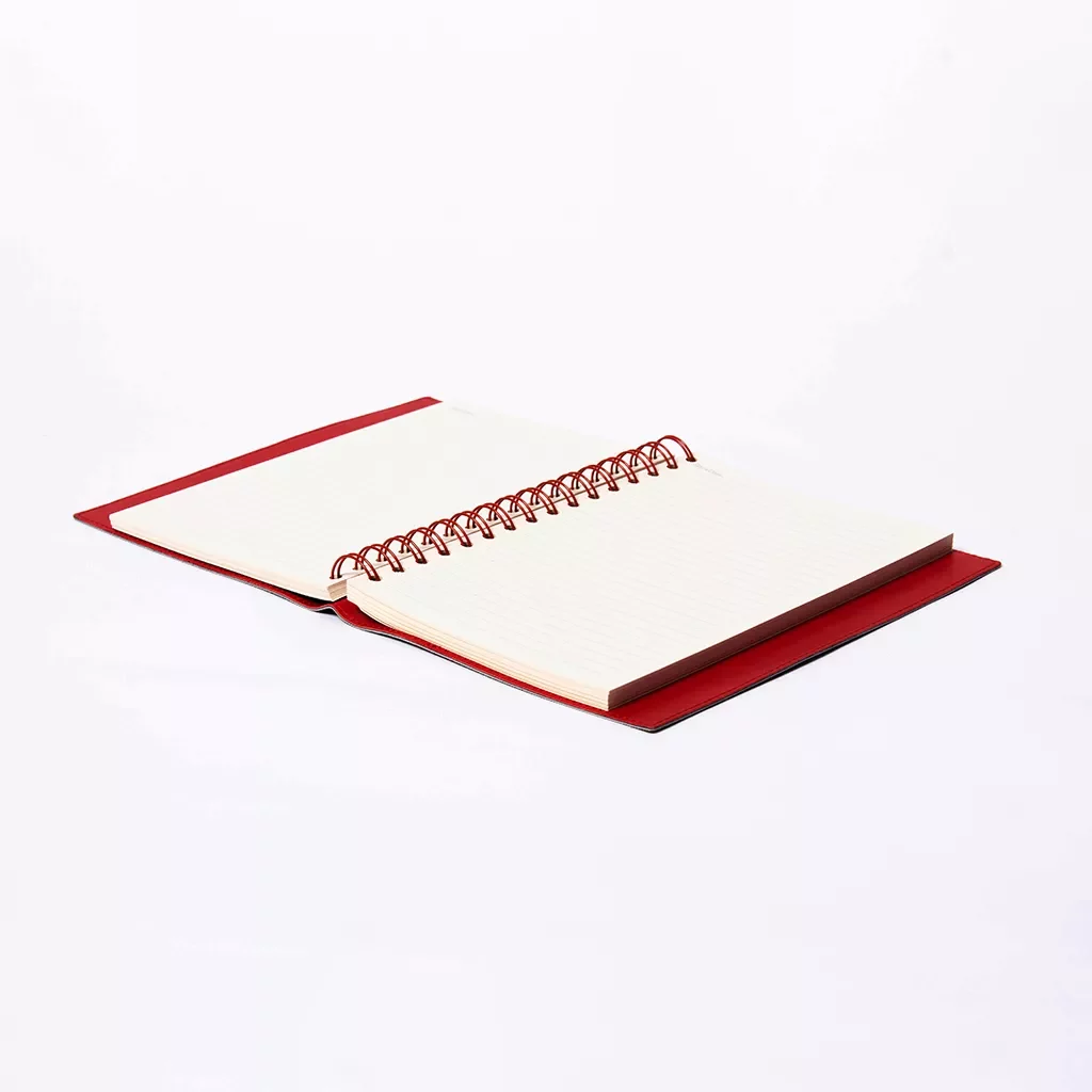 Lay-flat A5 spiral journal with integrated pen holder