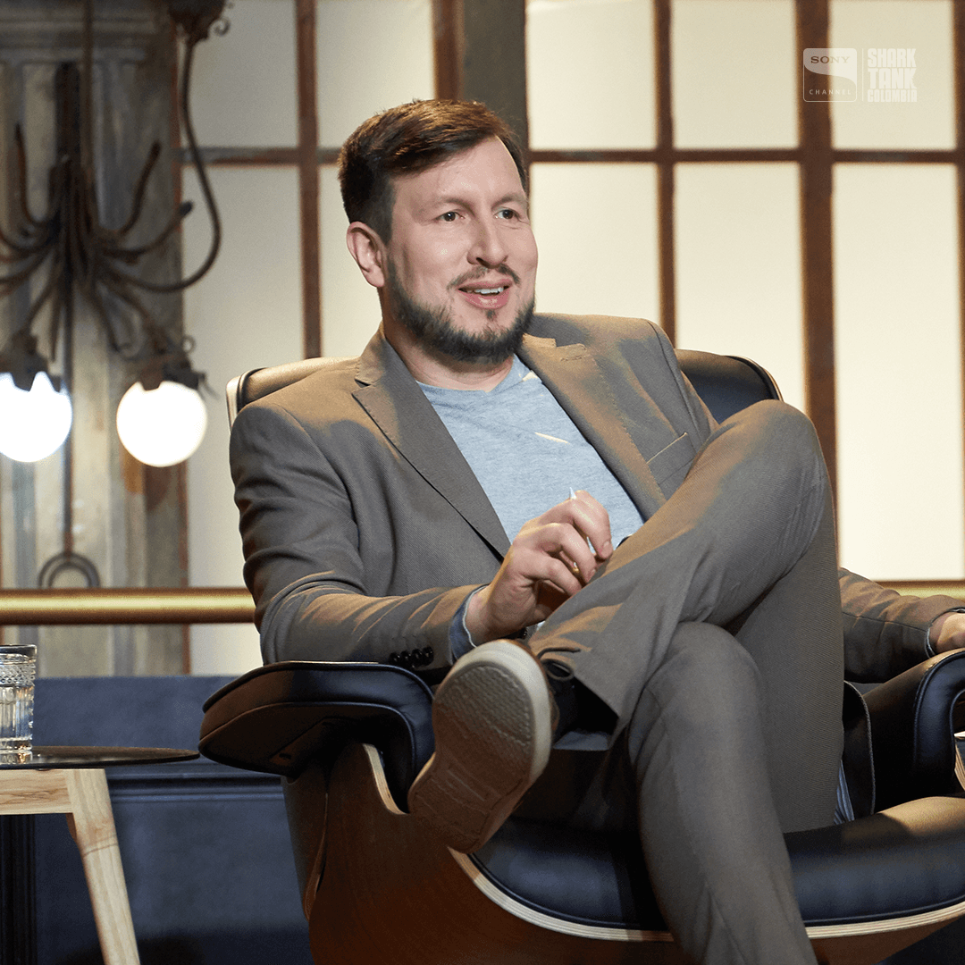 two ladies looking at a laptop and smiling