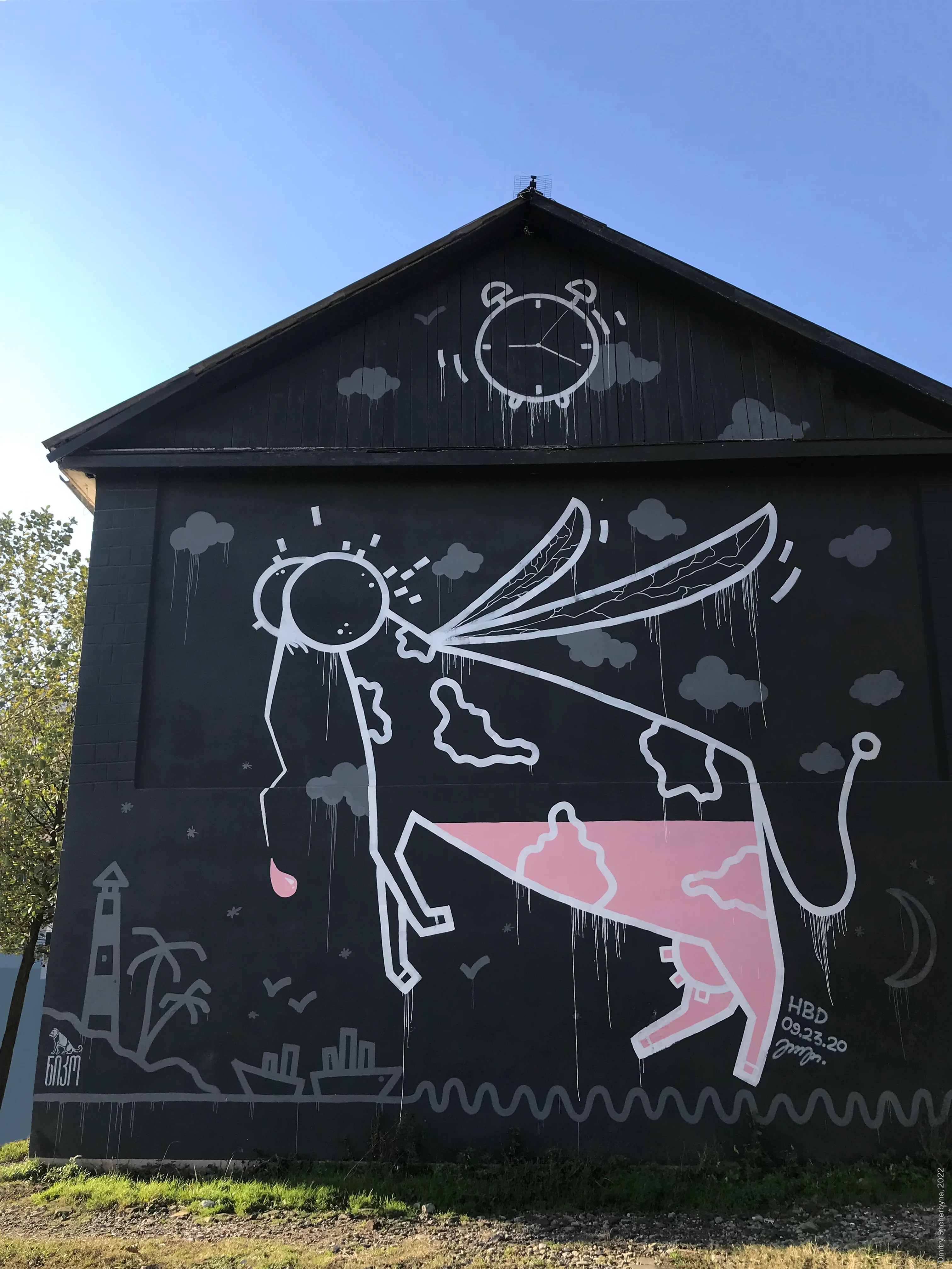 A white line drawing of a large creature on a barn wall. It looks like a pink cow with a mosquito's face. At the top of the roof is surrounded by grey clouds and an alarm clock.