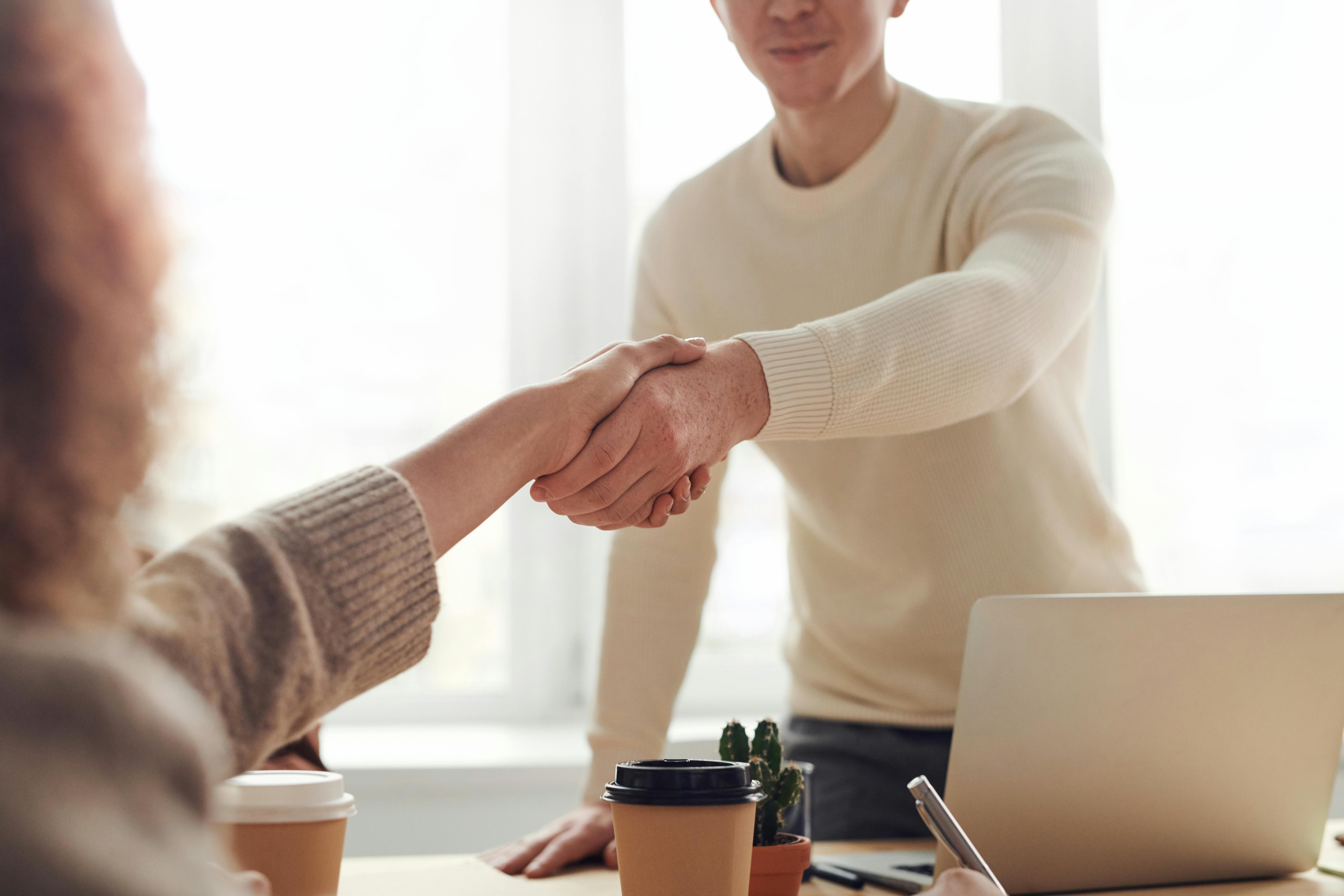 person sitting in a chair in front of a man