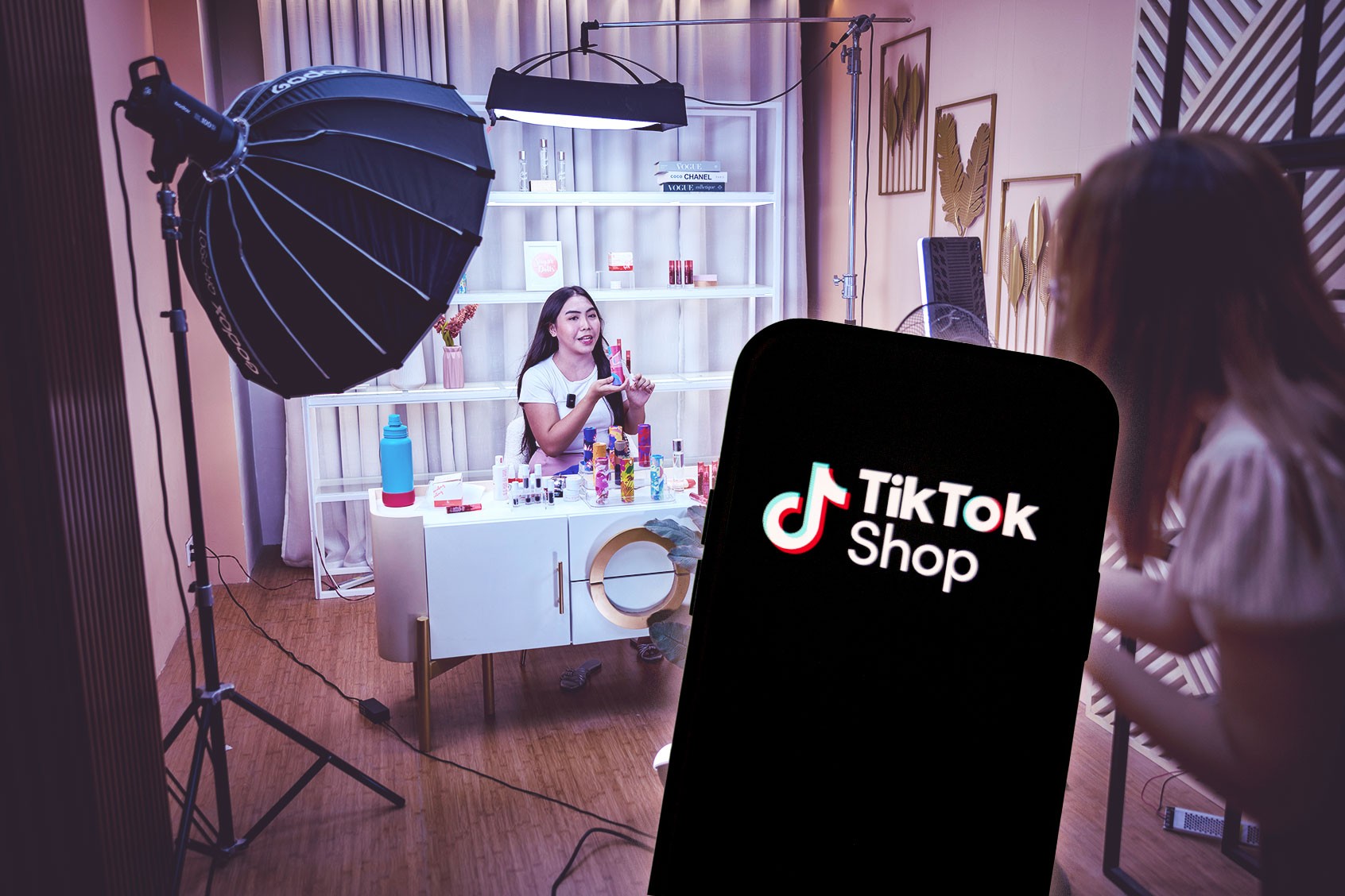 Creator hosting a TikTok Shop livestream, showcasing products in a designed storefront to drive real-time engagement and conversions.